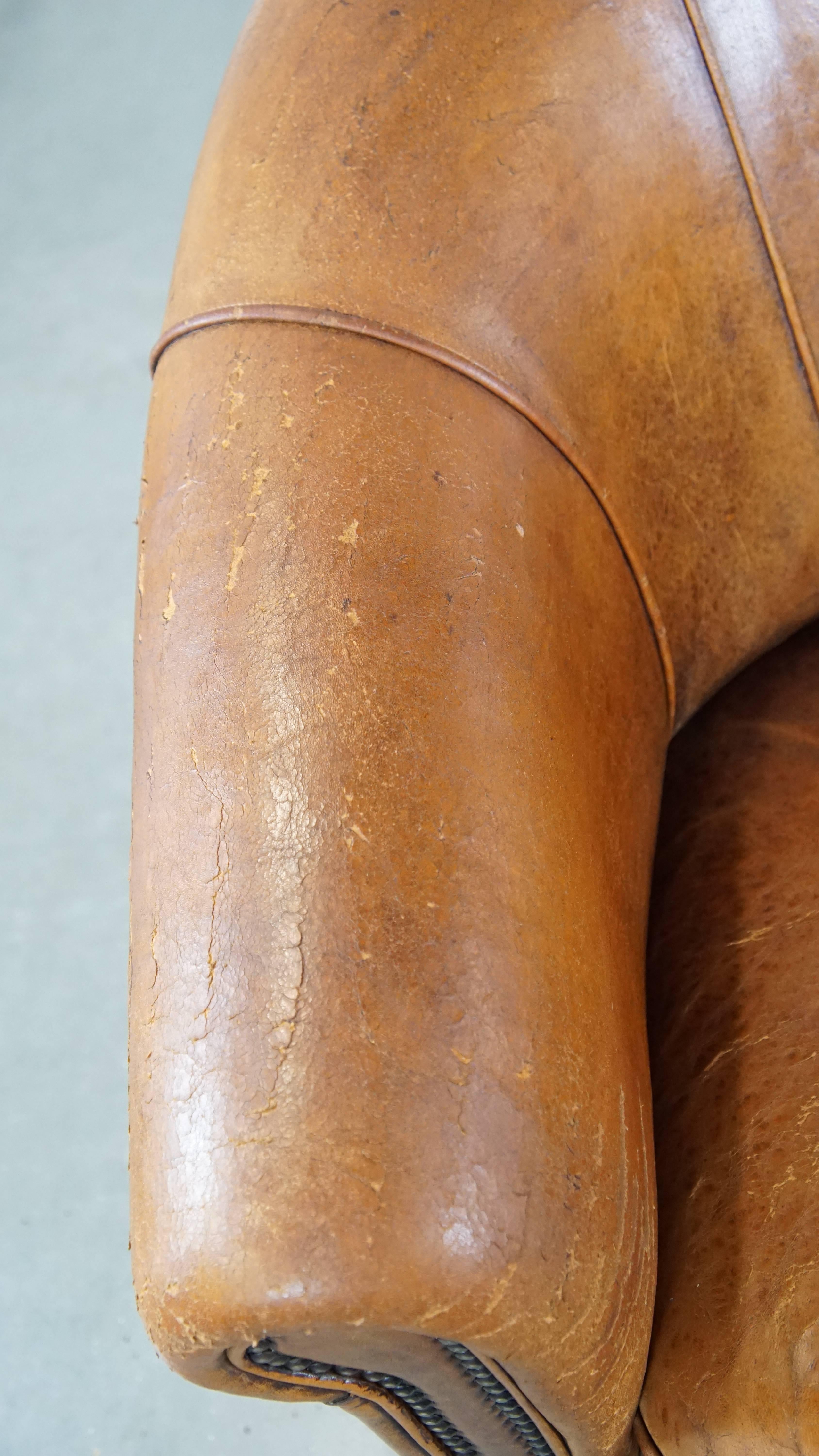 Charming, sturdy and comfortable cognac-colored sheepskin leather club armchair For Sale 1