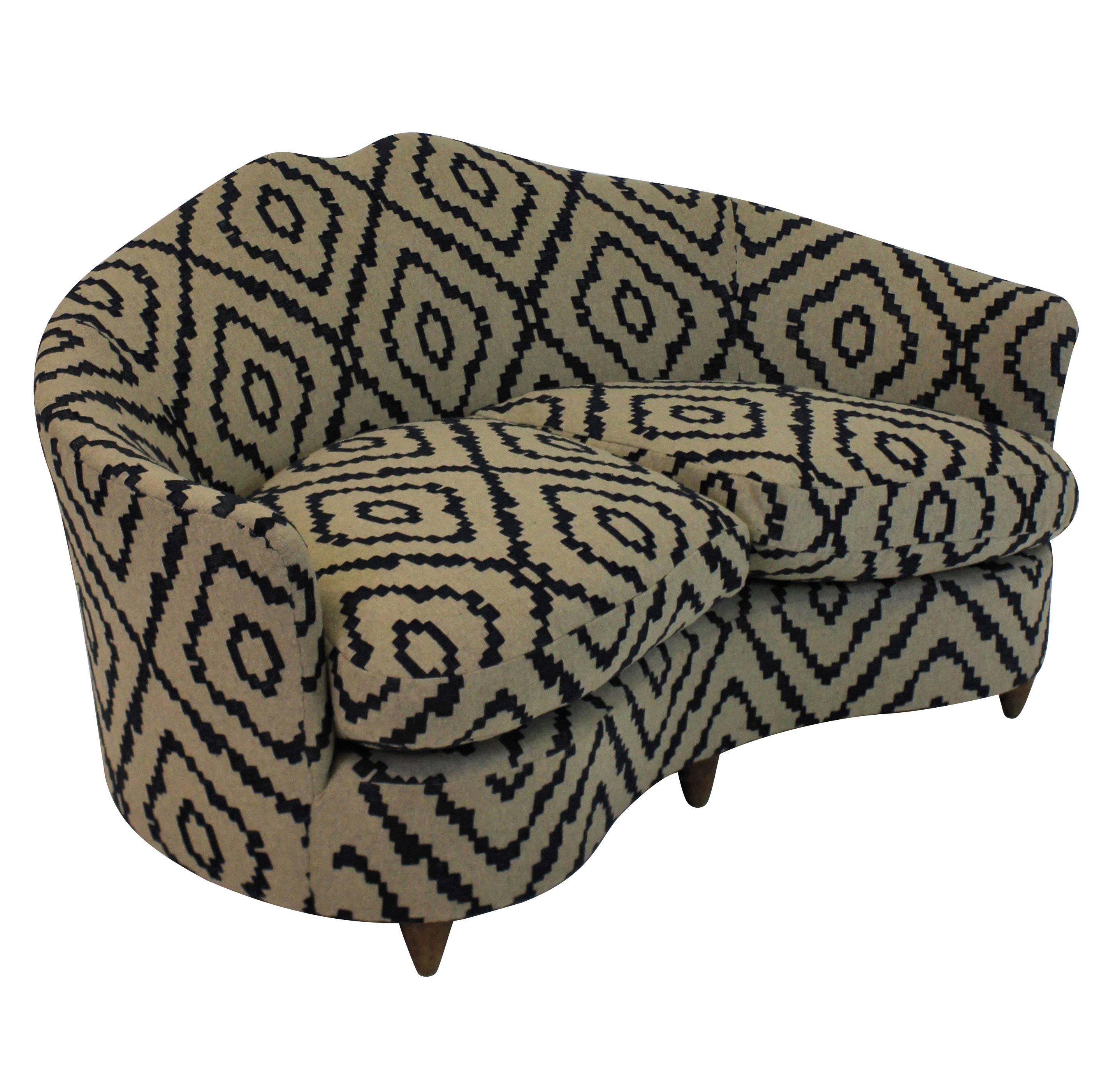 A charming two-seat curved sofa by ISA. With sculpted back and feather pads, new upholstered in Romo wool fabric.



