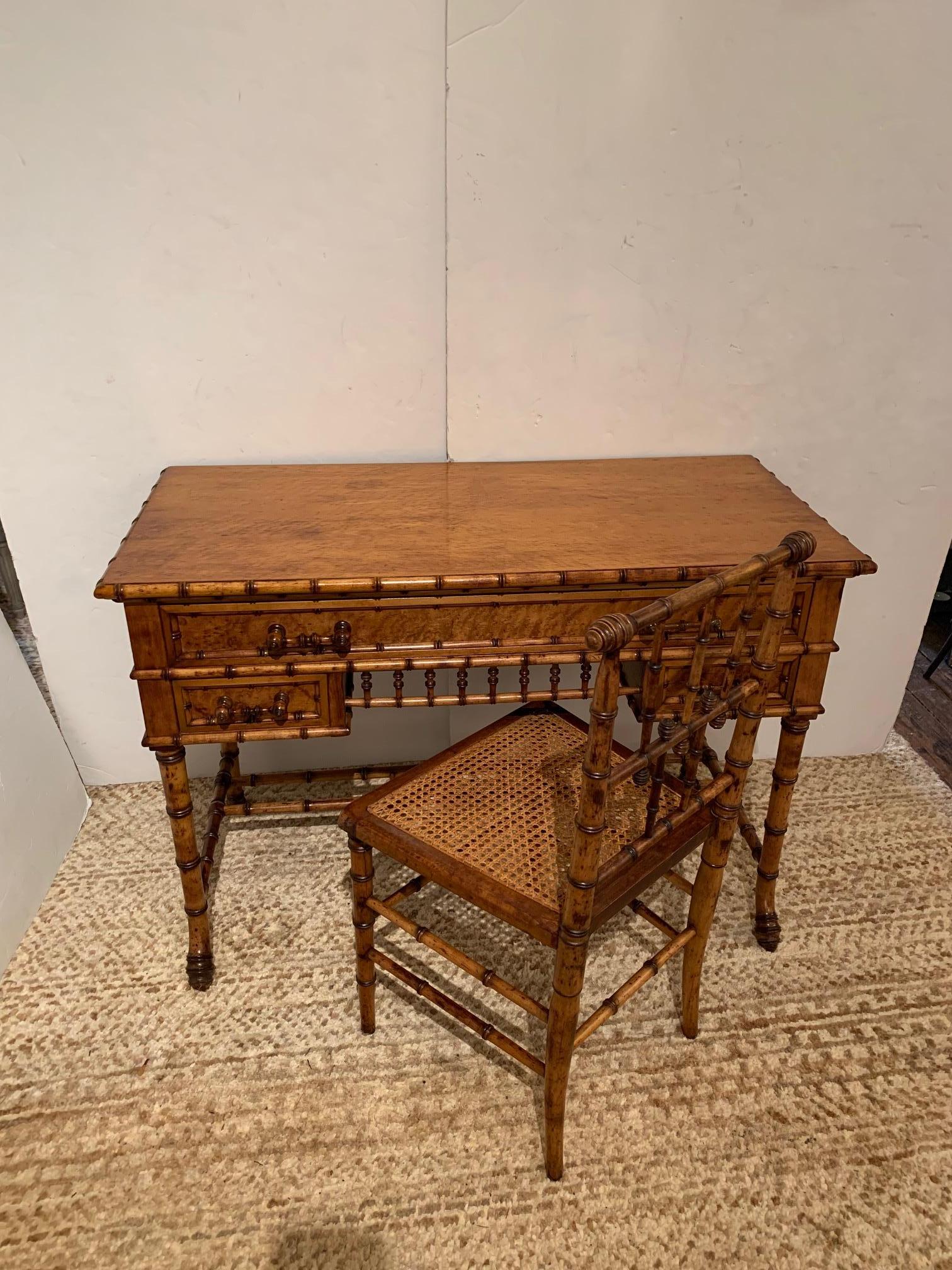 Gorgeous vintage honey colored wood, rattan and bamboo writing desk with matching chair. Desk has top long drawer with two smaller drawers beneath. 
 Chair has caned seat. All in very good condition as was just restored.
Measurement for desk is