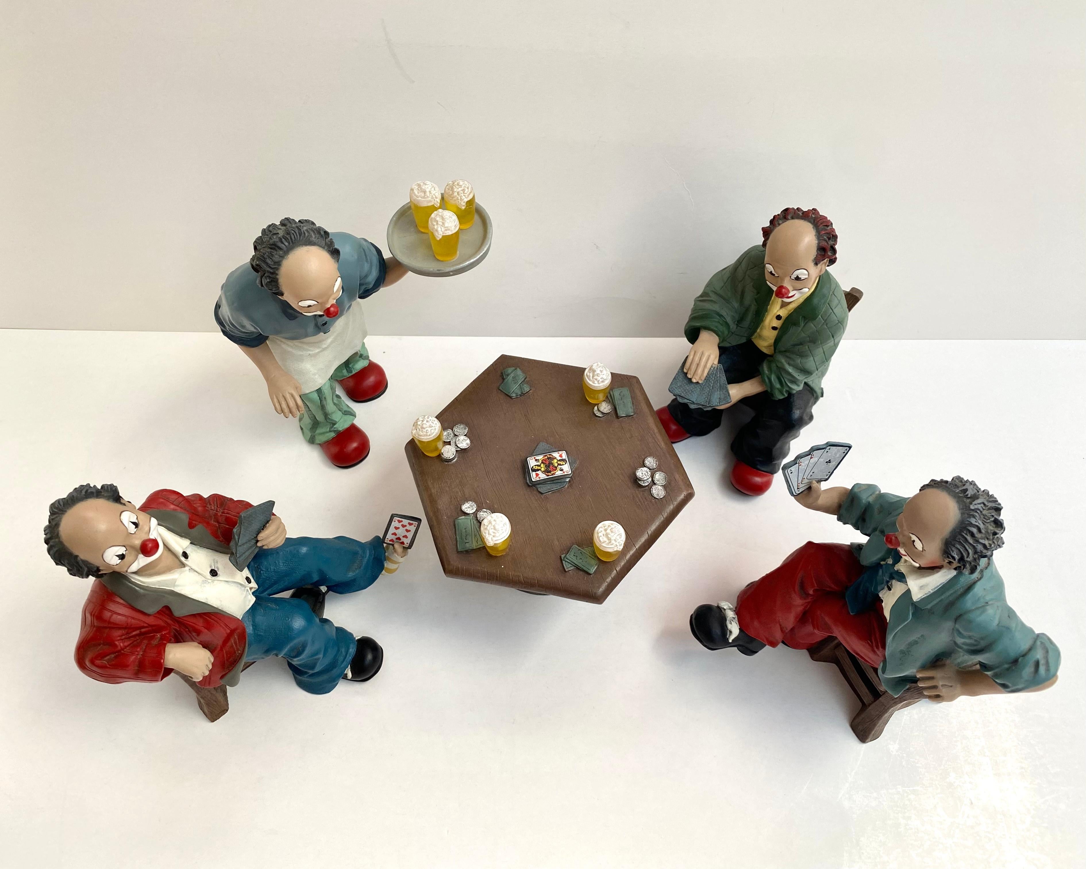 5 PIECE SET OF 4 HAND PAINTED CLOWNS SITTING AROUND TABLE PLAYING POKER - VERY DETAILED.

Gilde, Germany, 1990s.

Vintage 5 piece set of four clowns playing poker and a head waiter. They are all different. They are dressed in jeans, shirts and
