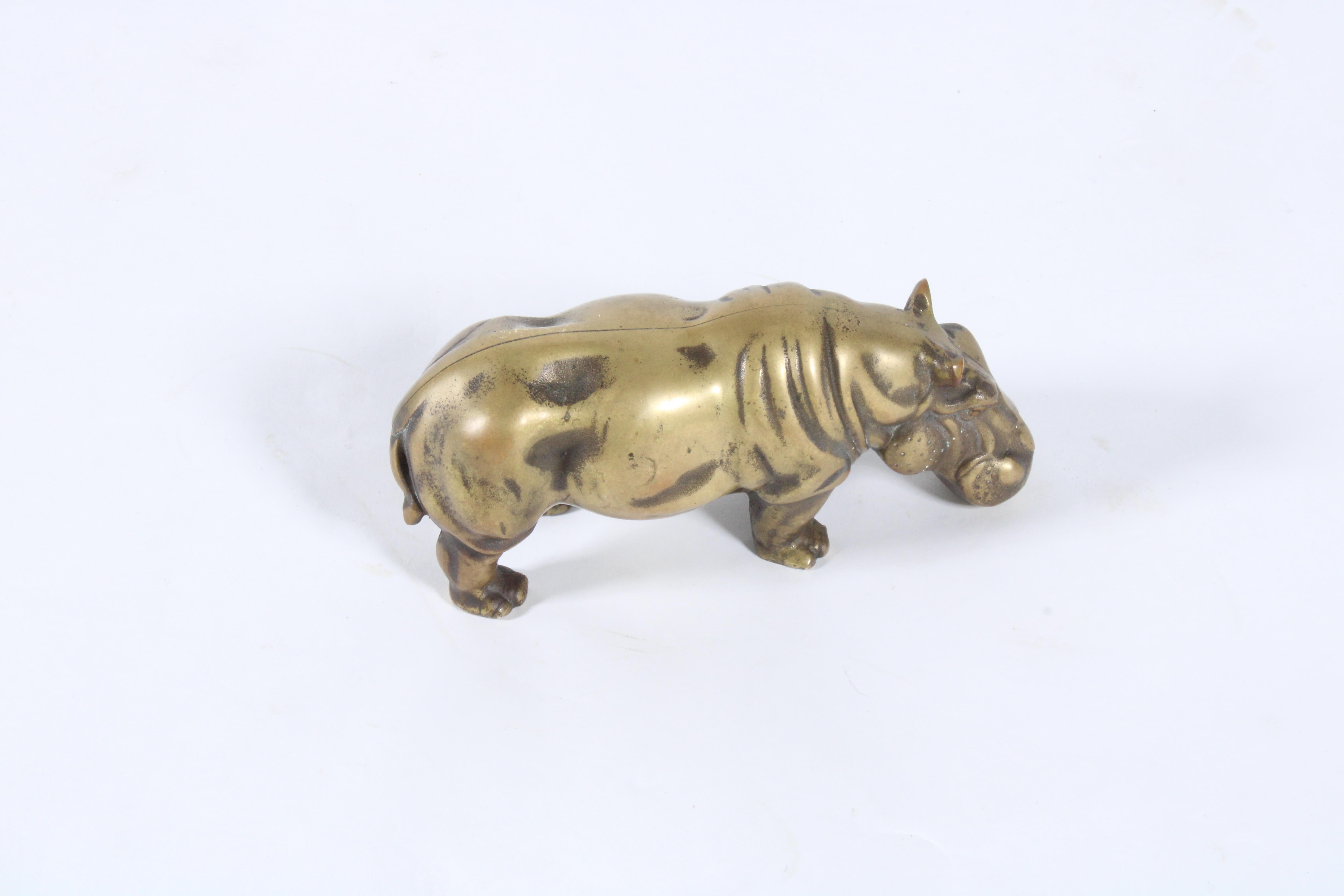 A charming vintage Italian sculpture in the form of a hippopotamus. Executed in brass this beautiful piece is a super stylish and fun piece of home decor, suitable for any home or commercial premises.