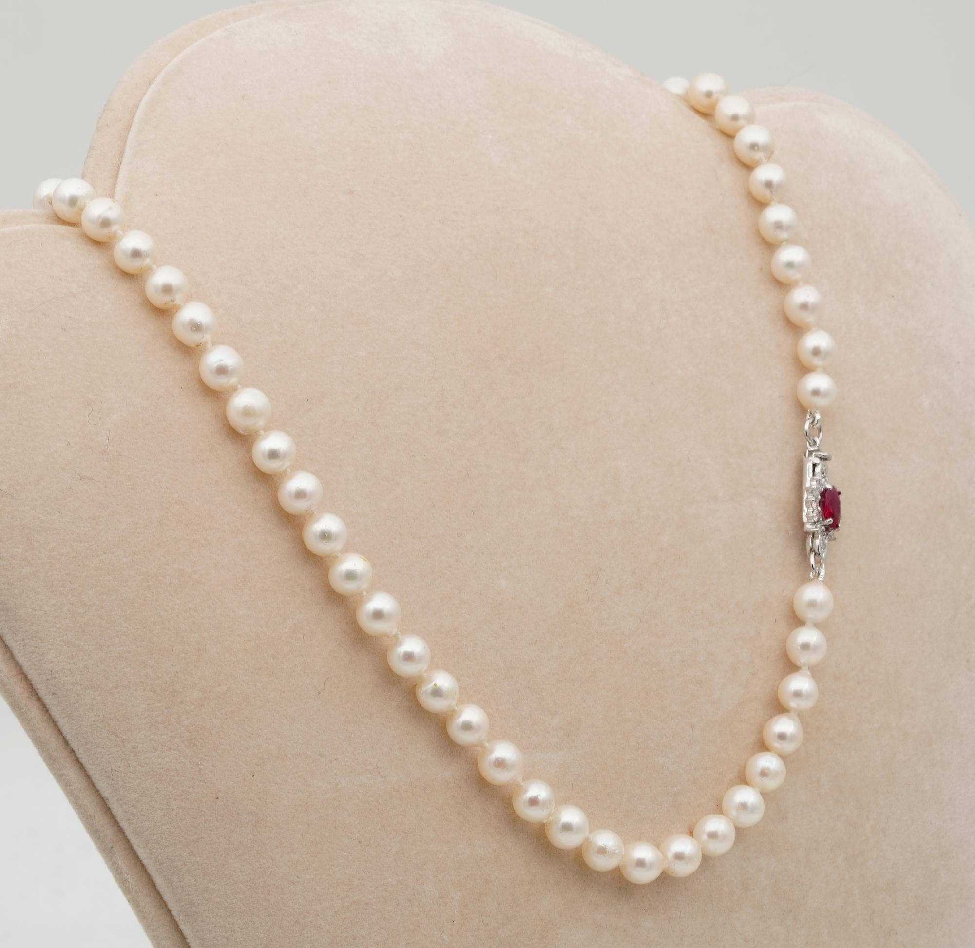 The Classy Must

Nothing can express eternal elegance than a simple strand of Pearls on a lady decolletes
This charming single strand of vintage Pearl is 50's – beautifully complemented by a Ruby and Diamond clasp
Comprising a string of 7 mm.