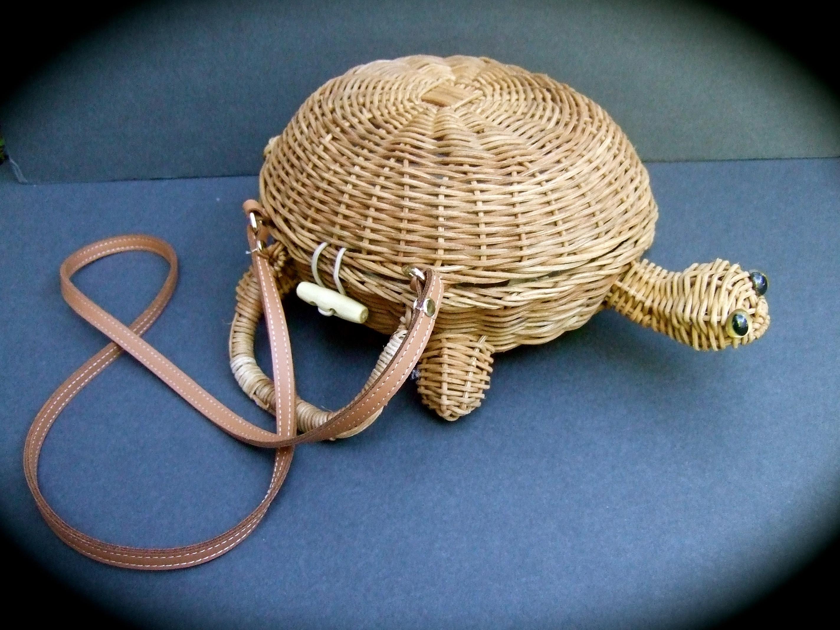 Charming woven wicker turtle design versatile handbag - shoulder bag c 1990s
The unique handwoven artisan handbag is designed with an endearing 
turtle figure. The versatile design may be carried as chic handbag
It too may be carried as a stylish