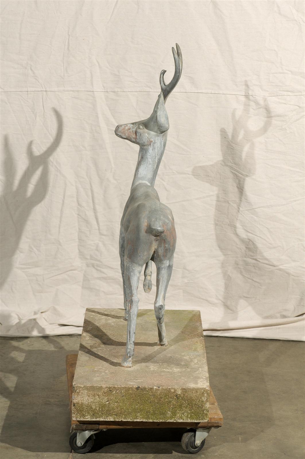 Charming zinc deer on cast base.