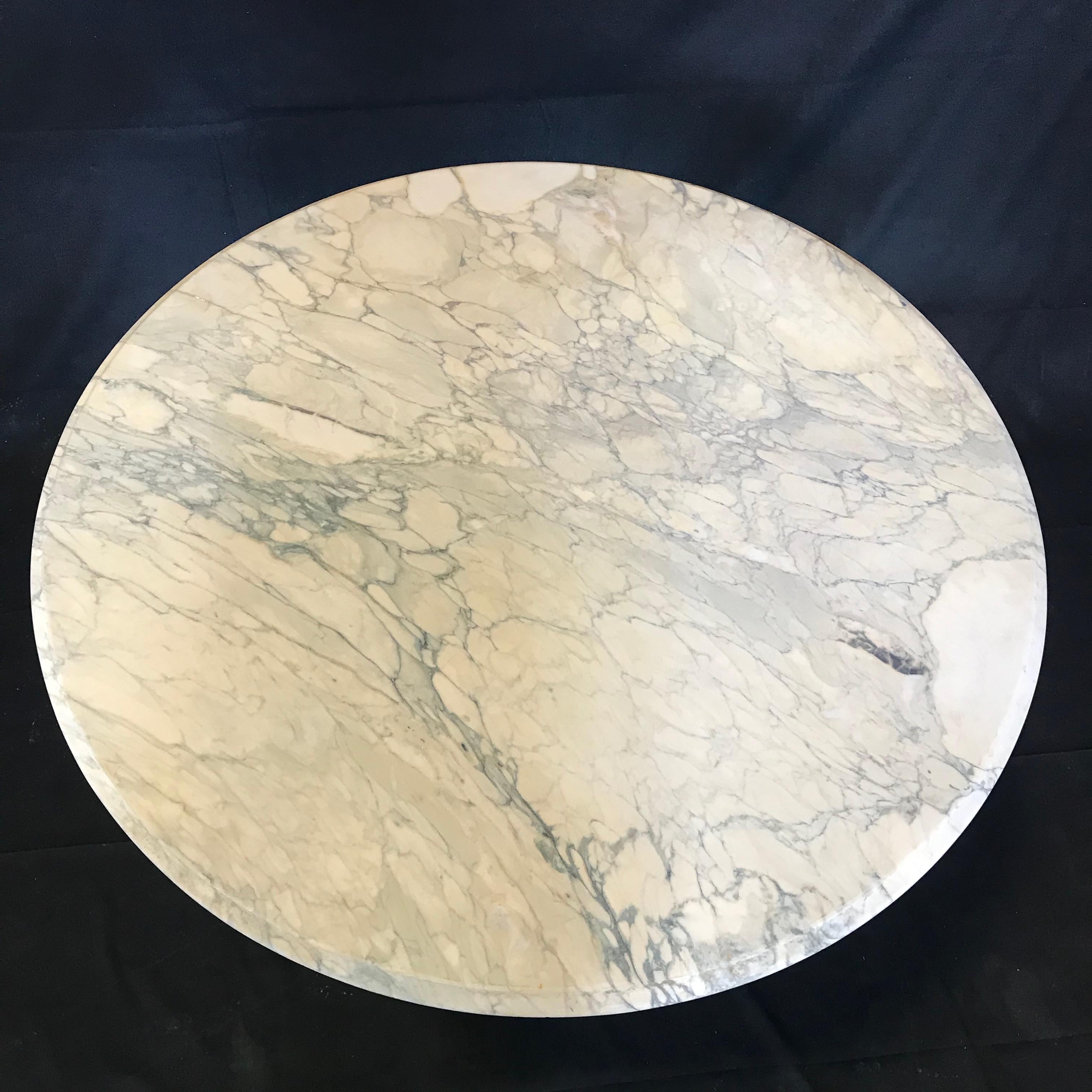 French cafe or bistro table having beautiful white Carrara marble top and dolphin feet on metal pedestal base - perfect for dining indoor or outdoors!
#3579
Measures: H skirt 26.75”.