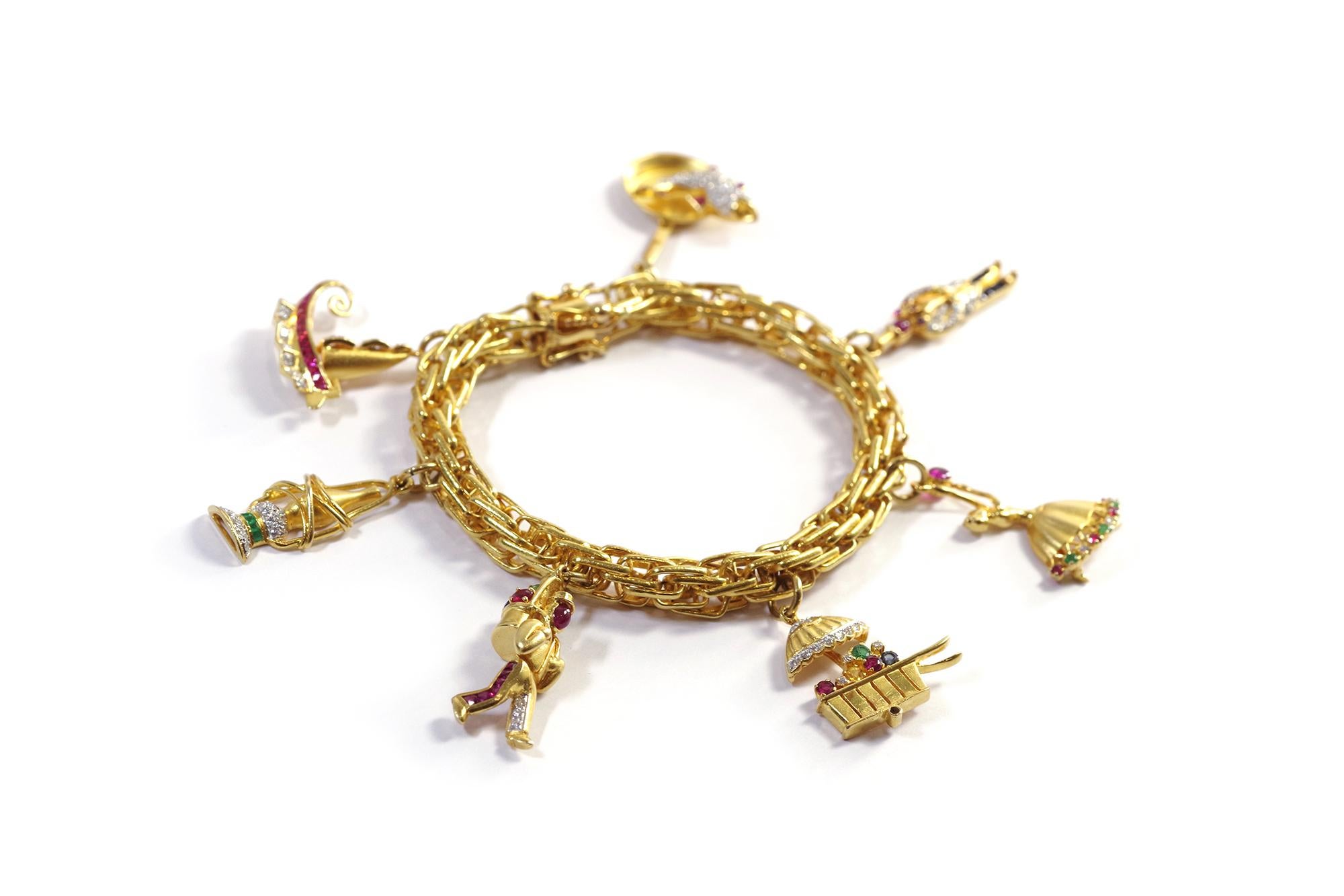 Round Cut Charms bracelet in 18k yellow gold, ship, lantern, flower, dancer