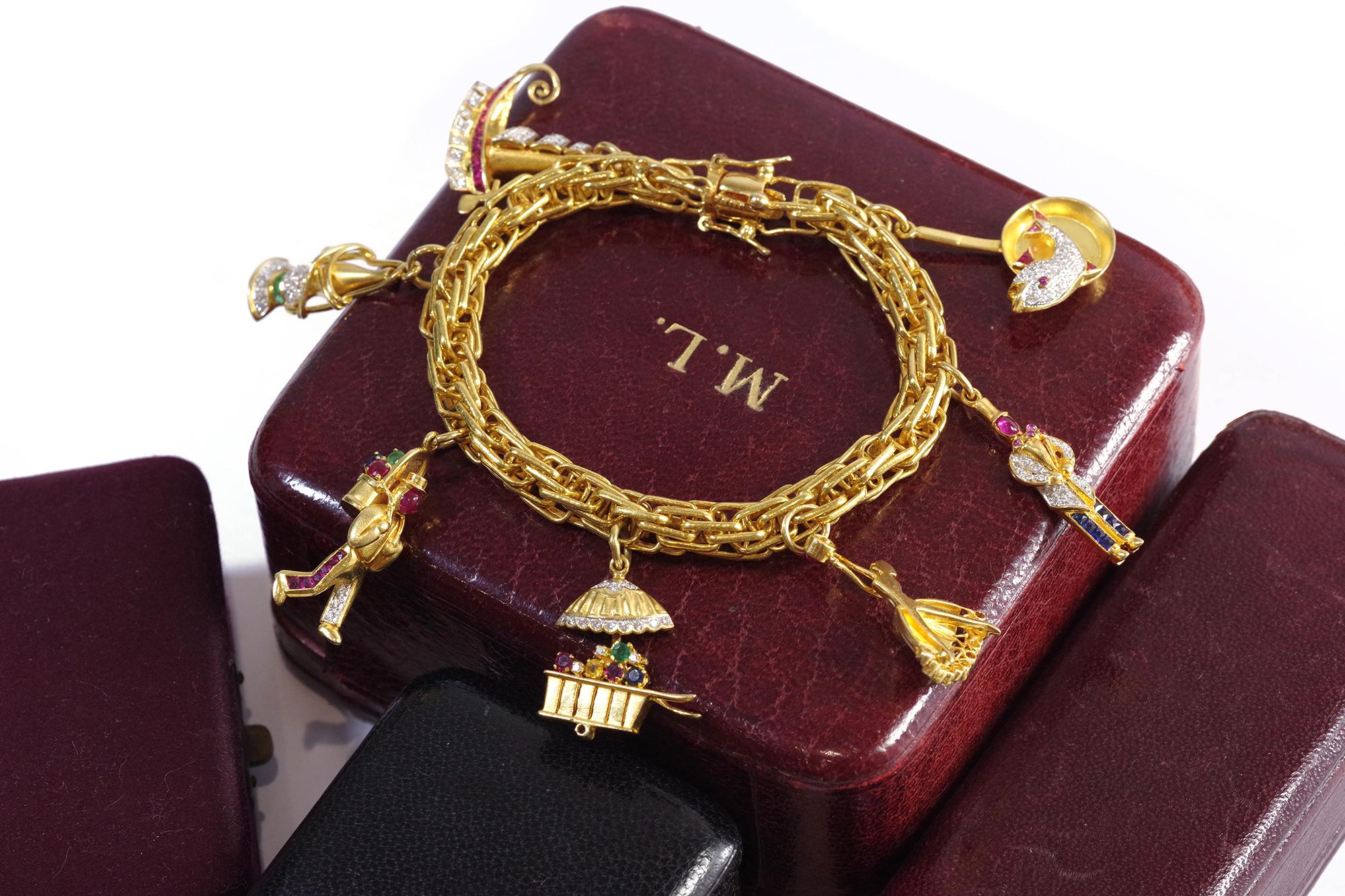 Charms bracelet in 18k yellow gold, ship, lantern, flower, dancer In Good Condition In PARIS, FR