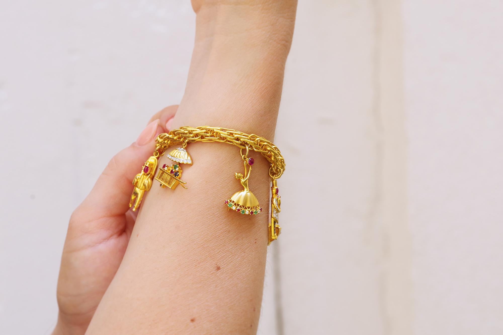 Charms bracelet in 18k yellow gold, ship, lantern, flower, dancer 1