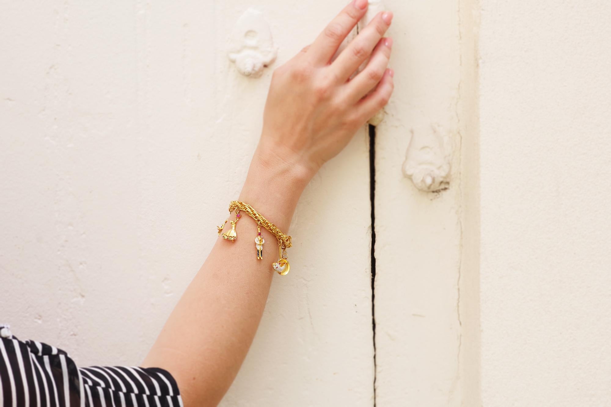 Charms bracelet in 18k yellow gold, ship, lantern, flower, dancer 2