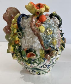Green twirls flowers. Glazed ceramic abstract jar sculpture