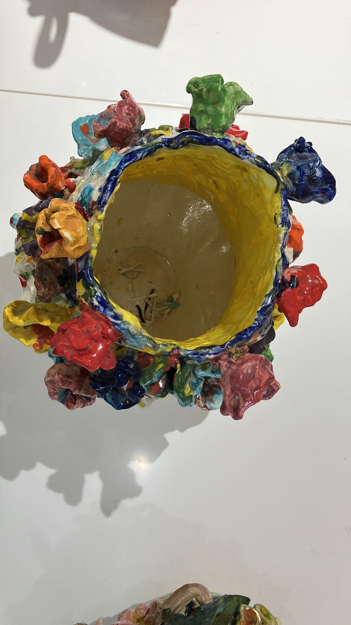 Colored flowers, by Charo Oquet
Glazed Ceramic
18” x 14” x 14”
2018

These gravity-defying ceramics stacked constructions struggle to soar beyond the boundaries of the spaces that contain them, often appearing to teeter in the brink of collapse.