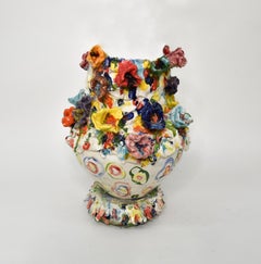 Colored flowers. Glazed ceramic sculpture