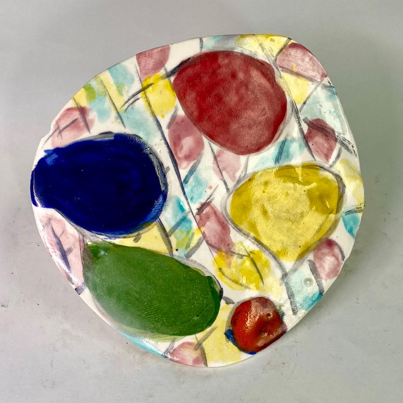 Untitled XXIV, by Charo Oquet
Glazed ceramic and enamel
Overall size: 27 H in x 23.5 W in. x 1 D in. 
Set of 14 Glazed Ceramic Discs
Individual size: 
1. 6” x 6” x 0.25