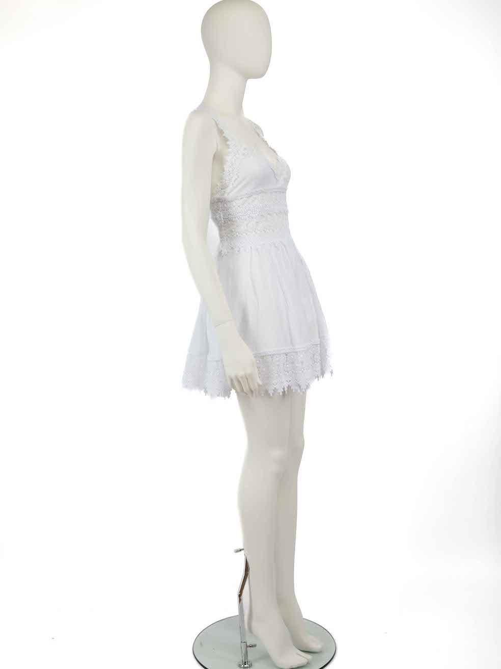 CONDITION is Very good. Hardly any visible wear to dress is evident on this used Charo Ruiz designer resale item.
 
 Details
 White
 Cotton
 Mini dress
 Sleeveless
 Floral lace trim accent
 V neckline
 See through on waist
 Elasticated back panel
 
