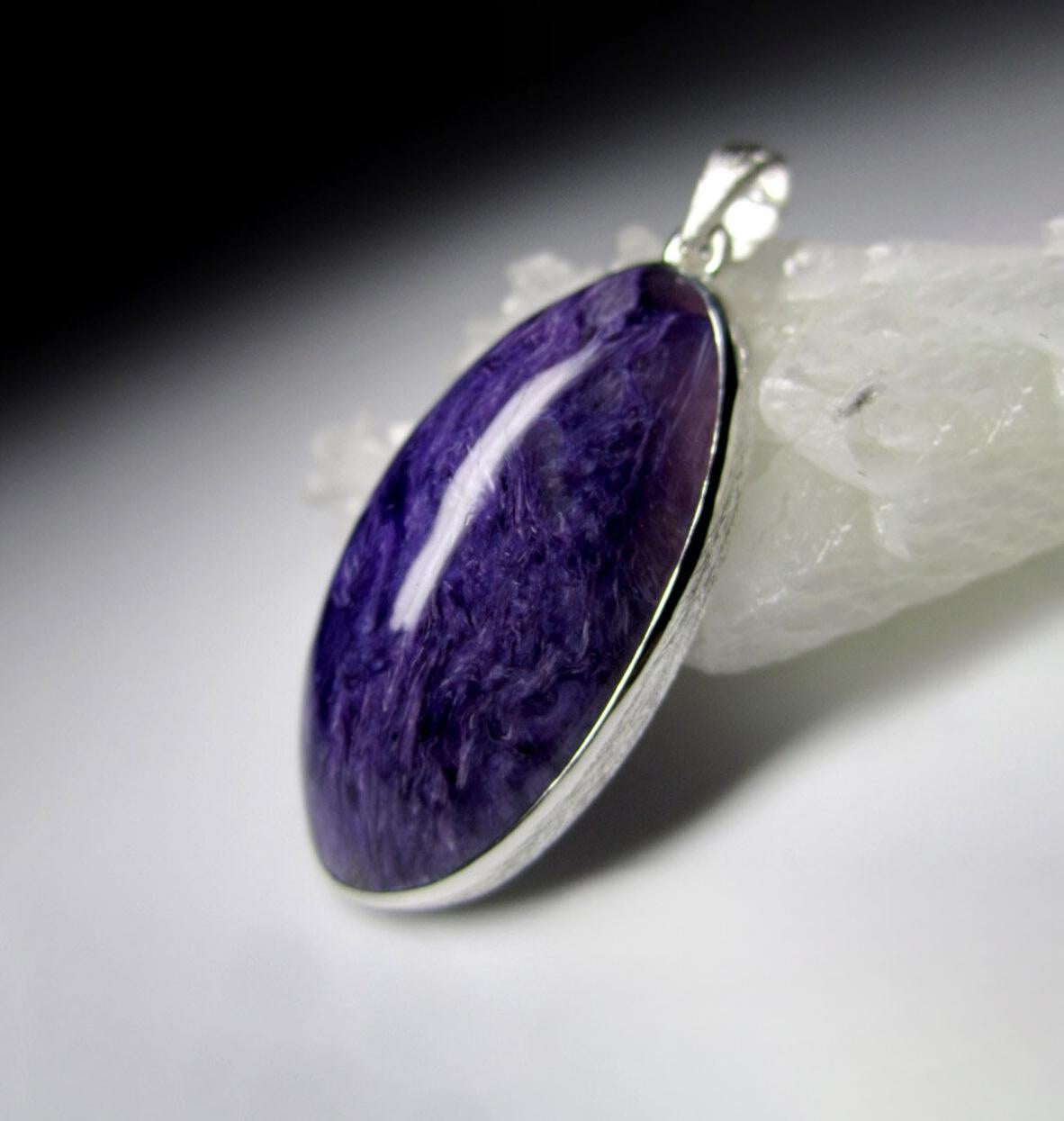 Scratched silver pendant with natural Charoite
charoite measurements - 0.35 х 0.79 х 1.38 in / 9 х 20 х 35 mm 
charoite weight - 49 carat
pendant weight - 12.67 grams
pendant height - 1.89 in / 48 mm