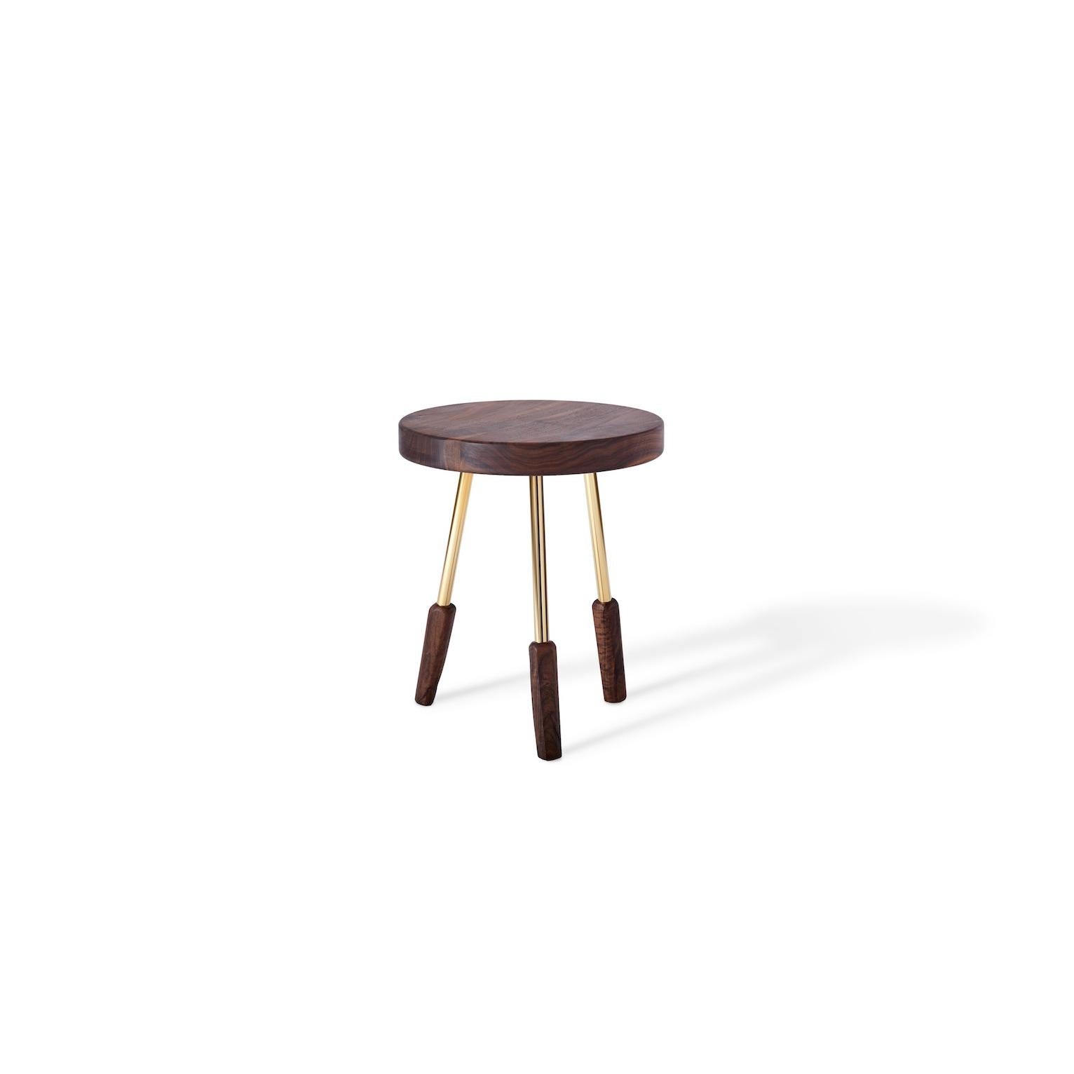 Milking stool with polished solid brass legs. Made in the USA by Casey McCafferty.

Image 1 shows charred ash
Picture 2 shows oiled walnut
Picture 3 shows oiled white oak 
Picture 4 shows bleached white oak 

Available finishes:
Oiled black