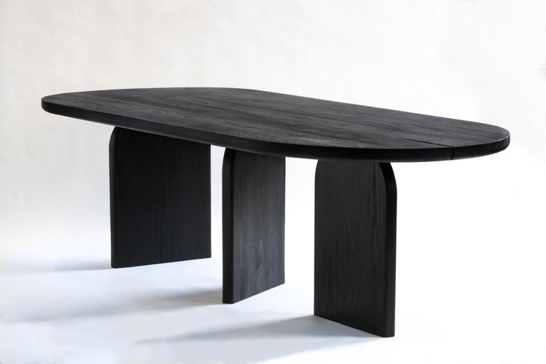 This dining table is constructed from solid Oak, Its top surface features hand chiseled Japanese joinery to celebrate the imperfections of the materials natural characteristics.

A blowtorch is used to char the surface creating a scaling texture
