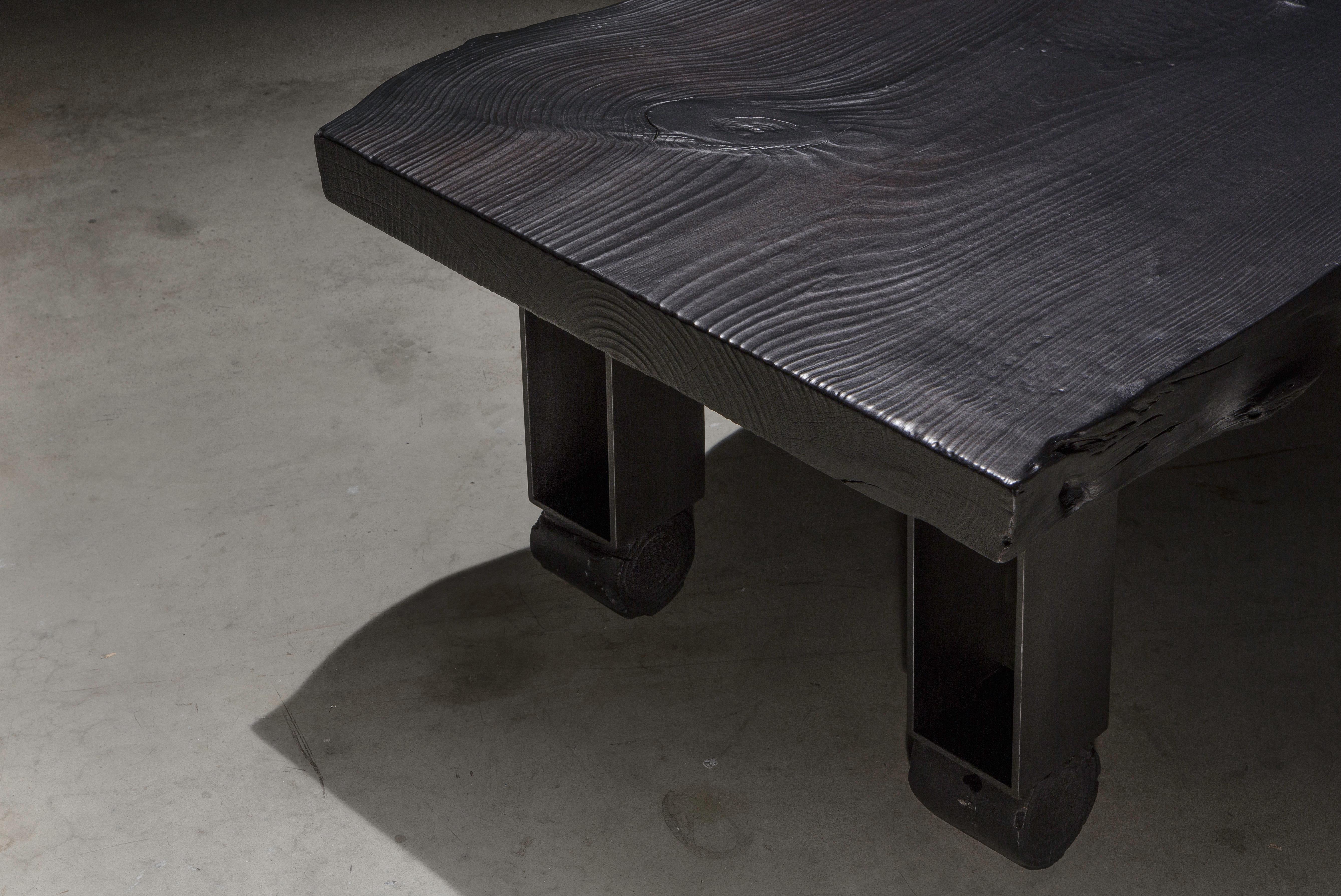 The Willis Coffee table is made of a solid live edge pine slab that has been charred using the traditional Japanese Shou Sugi Ban technique. It is set on top of four solid steel legs with round feet to add geometric style to the table. 

This is a