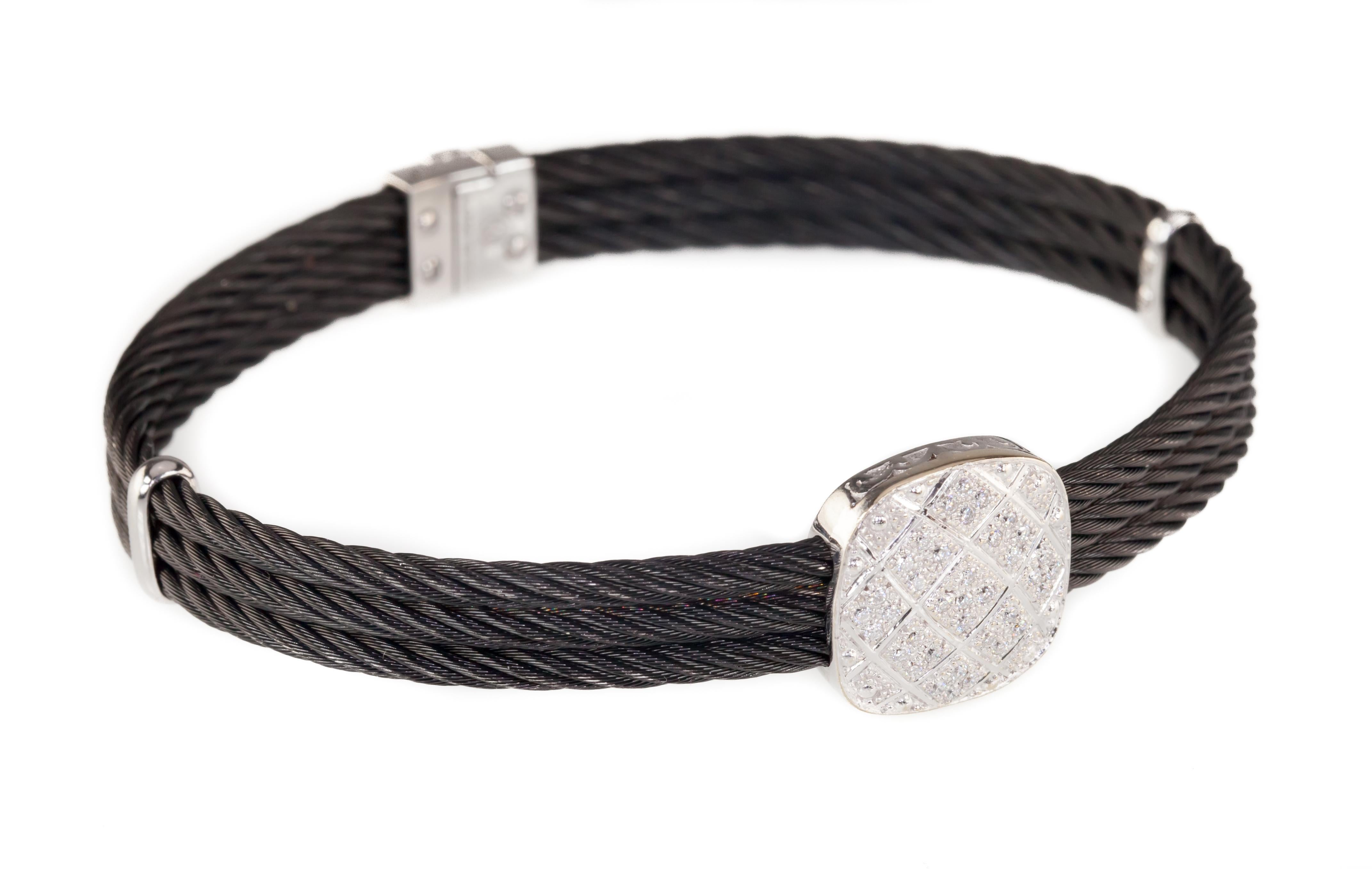 Gorgeous Three-Row Steel Cable Bracelet by Charriol
Features 18k White Gold Elements and Plaque
Total Diamond Weight = 0.20 Cts
Average Color = F
Average Clarity = VS1
Width of Band = 7 mm
Total Mass = 18.5 grams
Gorgeous Gift!