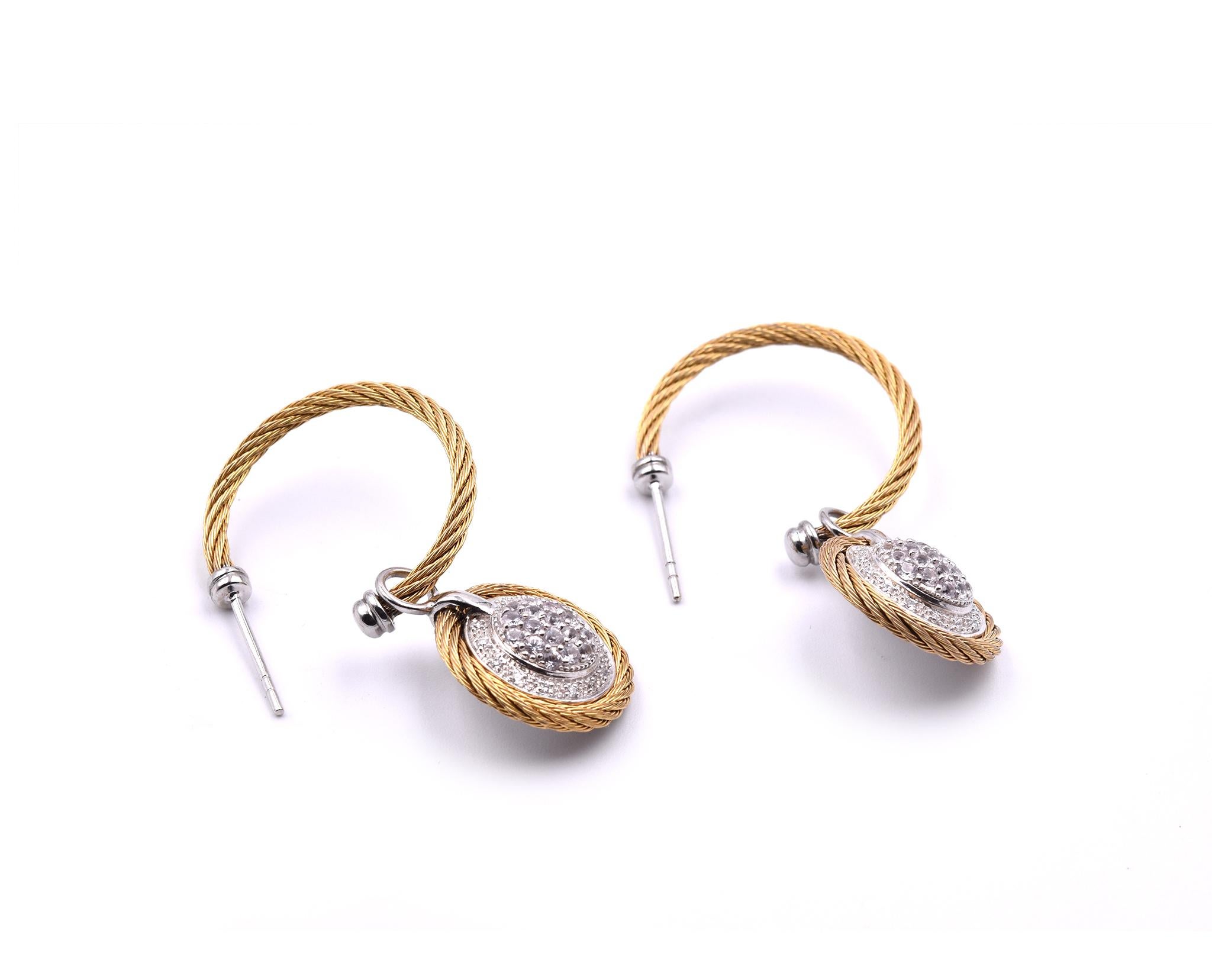Designer: Charriol
Material: 18k yellow gold and stainless steel
Diamonds: 66 round brilliant cut=.70cttw
Color: G
Clarity: VS
Fastening: post with friction back
Dimensions: earrings are approximately 43mm long and 16.50mm wide
Weight: 9.27 grams