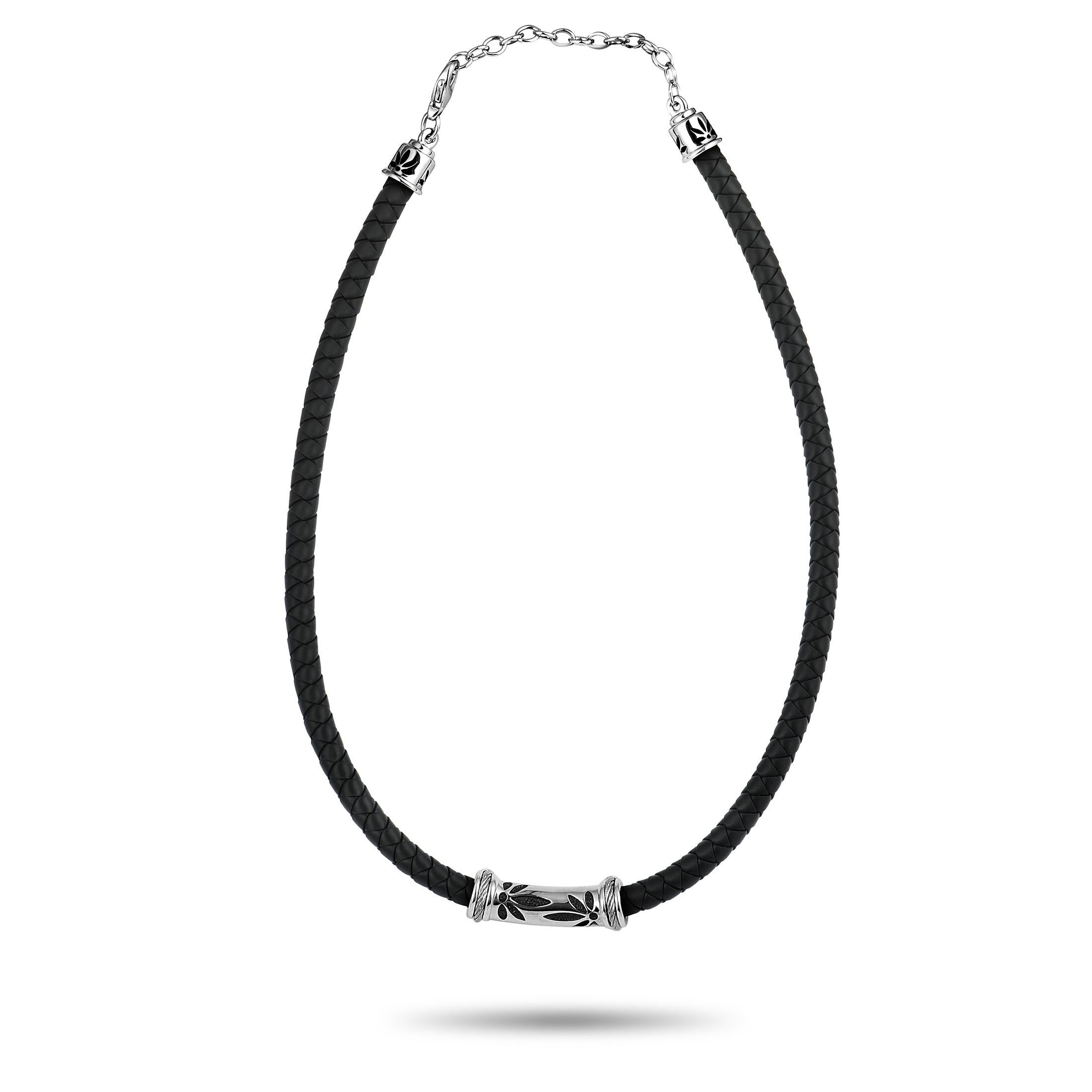 The striking black rubber cord brings out the elegant sheen of stainless steel in an exceptionally eye-catching fashion in this extraordinary “Bamboo” necklace that is presented by Charriol. The necklace weighs 24.1 grams.
Charriol Bamboo Stainless