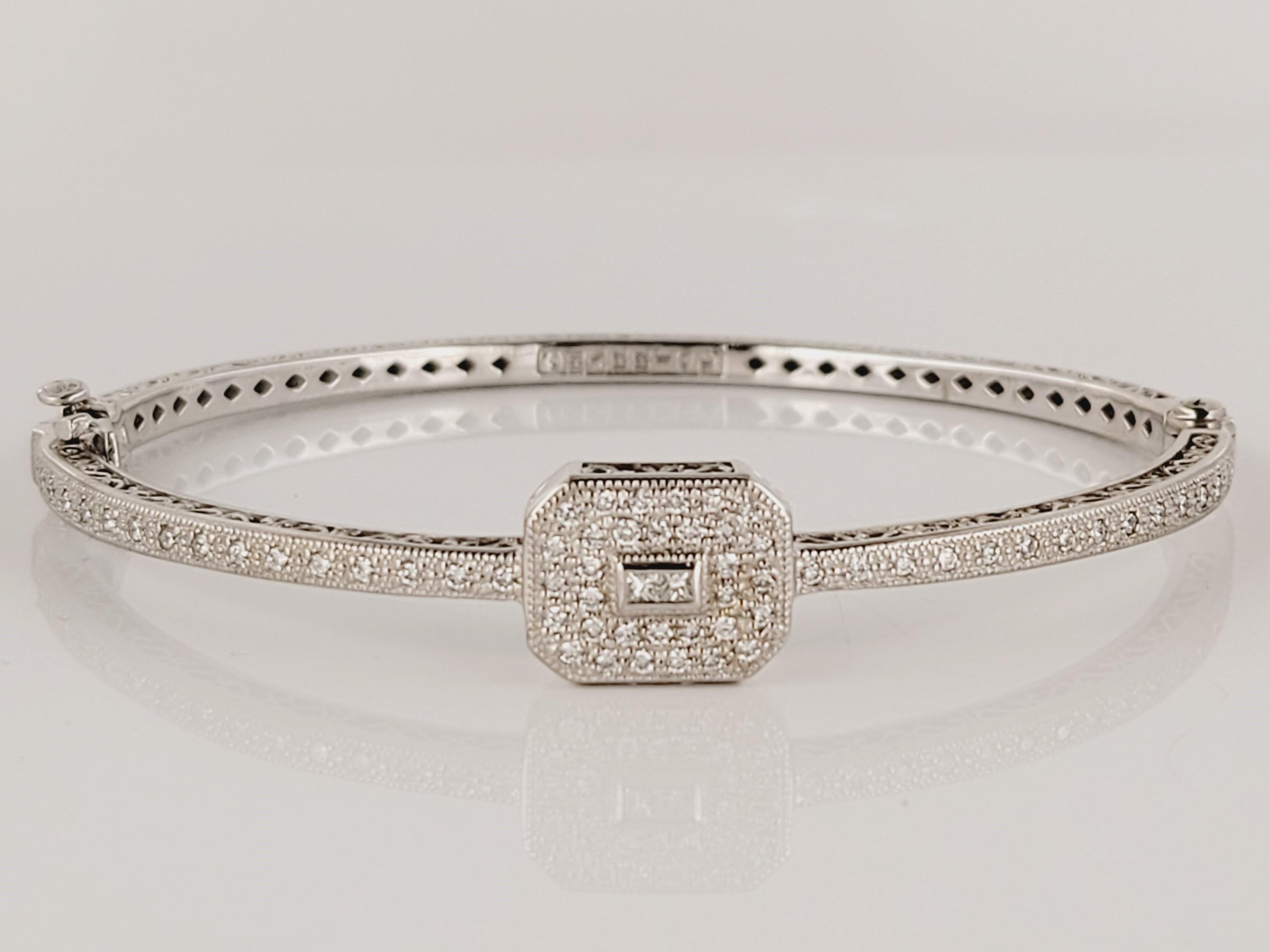 Rare Charriol White Gold Bangle with Diamonds
-Mint condition
-18k White Gold
-Weight: 17.5 gr
-Inner circumference: 6.8”
-Ornament Dimension: 10.7x13.5mm
-64 round pave set diamonds
-2 bezel set princess cut diamonds
-Total carat weight: 0.67