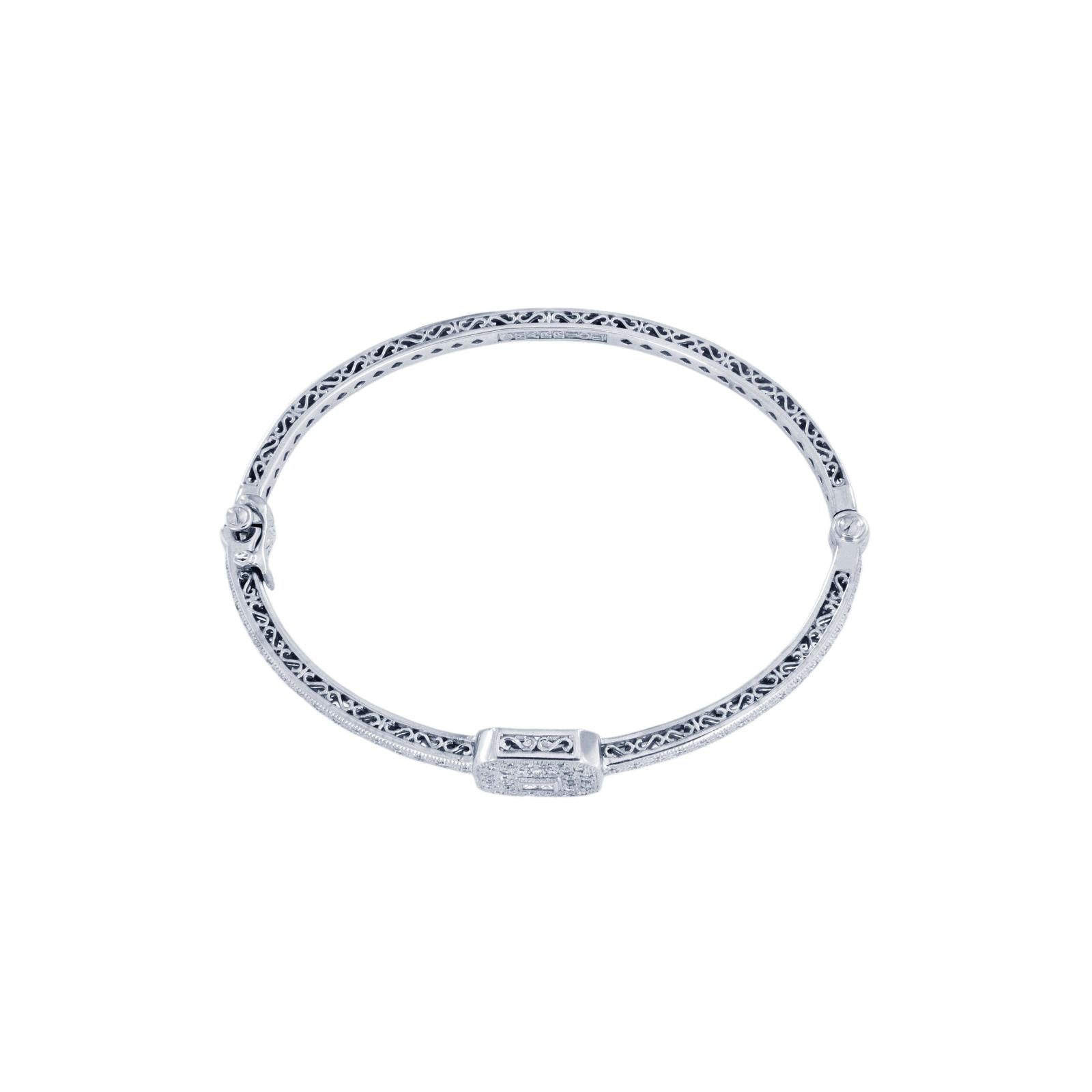 CHARRIOL BLANCHE FLAMME COLLECTION 18K WHITE GOLD DIAMOND BANGLE BRACELET

-Rare Charriol White Gold Bangle with Diamonds
-Mint condition
-18k White Gold
-Weight: 17.5 gr
-Inner circumference: 6.8”
-Ornament Dimension: 10.7x13.5mm
-64 round pave set