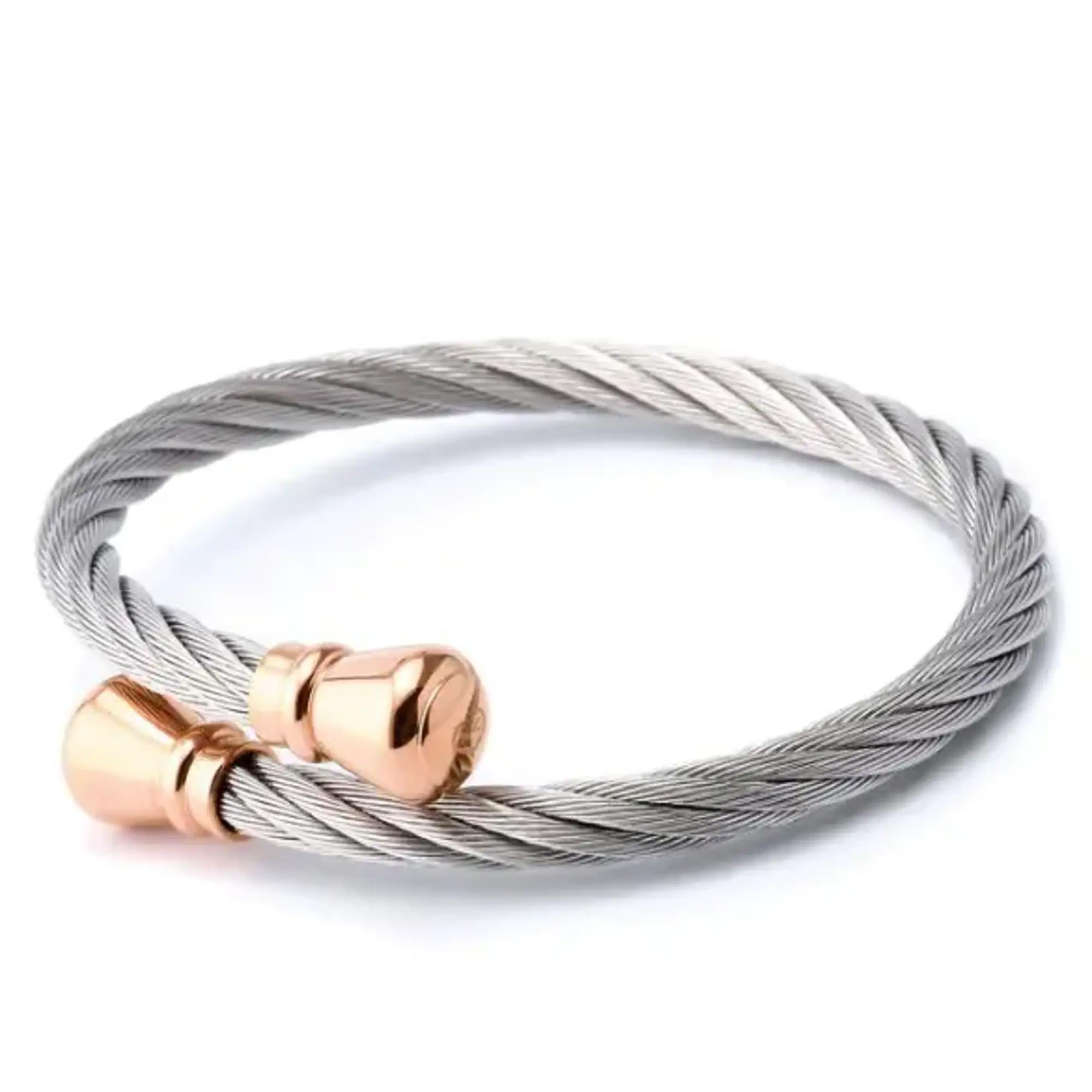 This gorgeous Charriol Celtic Bourse open cuff bangle bracelet is a perfect addition to your everyday look. Super stackable and easy to wear, it features rope style stainless steel bracelet with rose gold color PVD plated ends. Size: Medium. Total