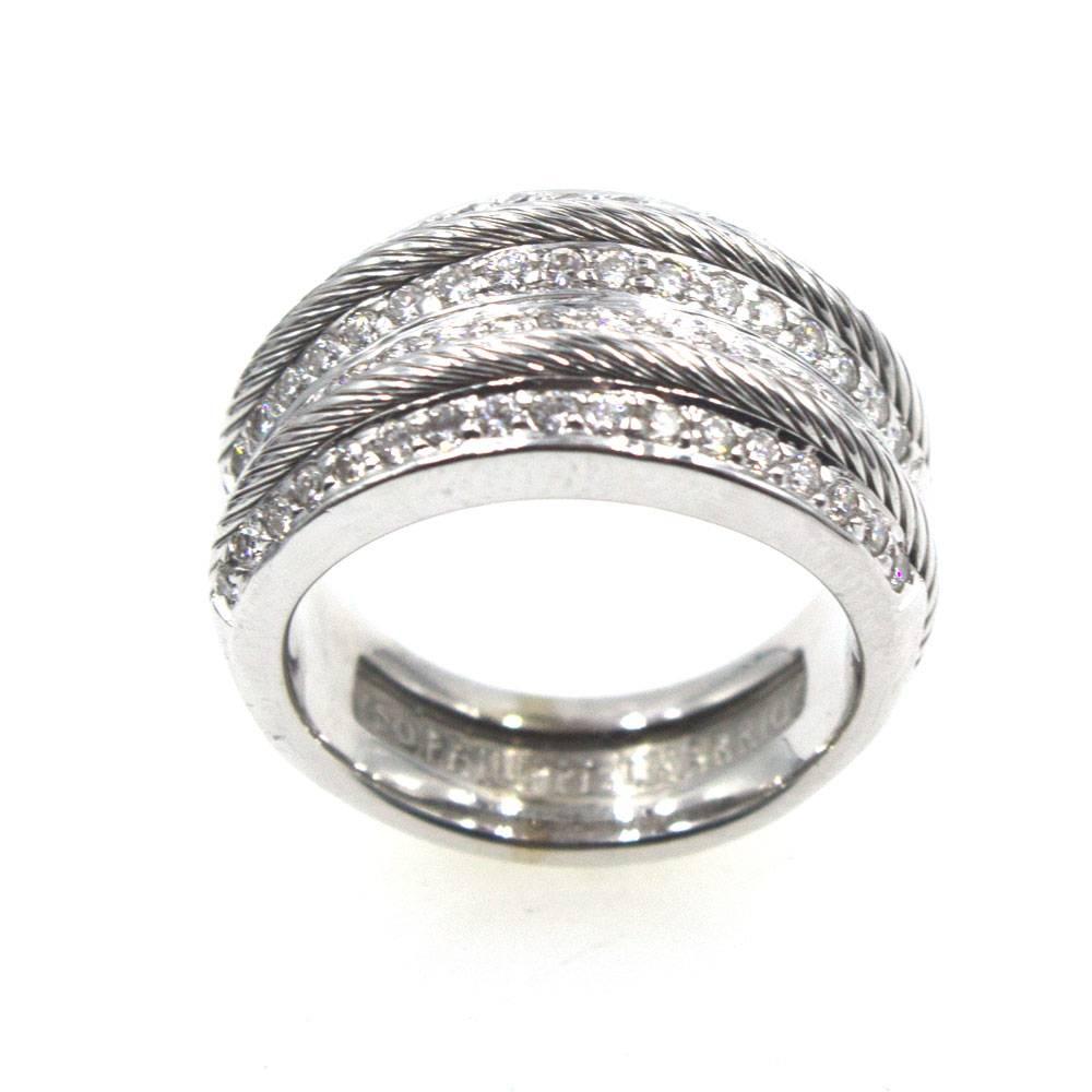 Stylish wide diamond band by designer Philippe Charriol. The ring features textured cable white gold alternating with 4 rows of diamonds. The ring is currently size 6.5 (can be sized), and measures .5 inches in width. There are .72 carat total