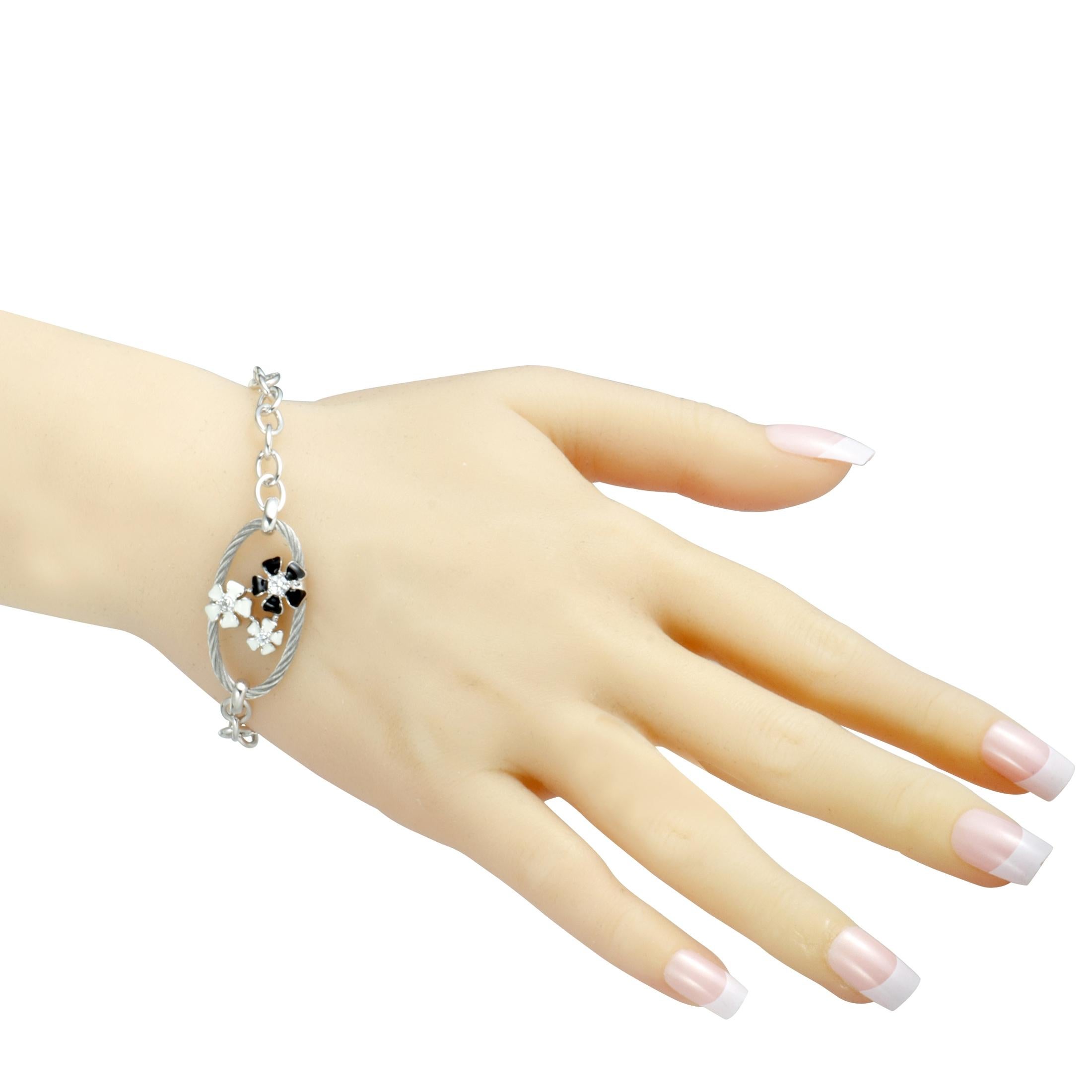 The beautifully designed and splendidly decorated flowers give an endearingly feminine appeal to this lovely “Fleur des Alpes” bracelet that is presented by Charriol and exquisitely made of stainless steel. The flowers are embellished with white and