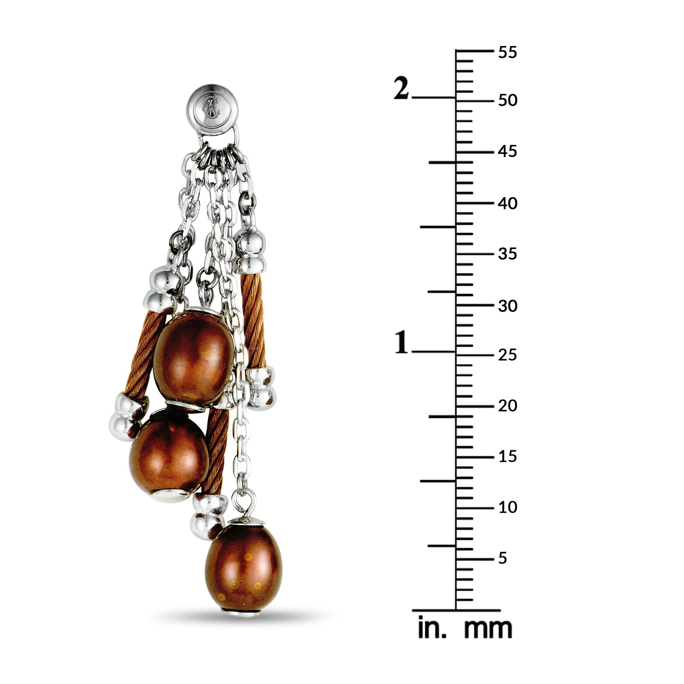 These fashionable “Pearl” earrings presented by Charriol are wonderfully crafted from partially bronze PVD-coated stainless steel and embellished with attractive brown pearls. Each of the two earrings weighs six grams.