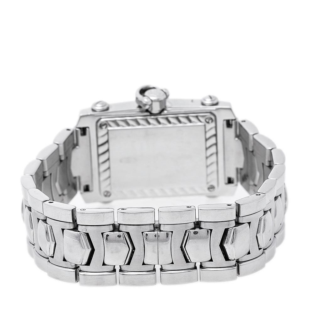 Coming from the house of Charriol, this watch features a stainless steel case of 25 mm diameter. It is designed with a classic rectangular-shaped bezel that comes studded with diamonds and a silver dial with a date window and hour markers. Powered