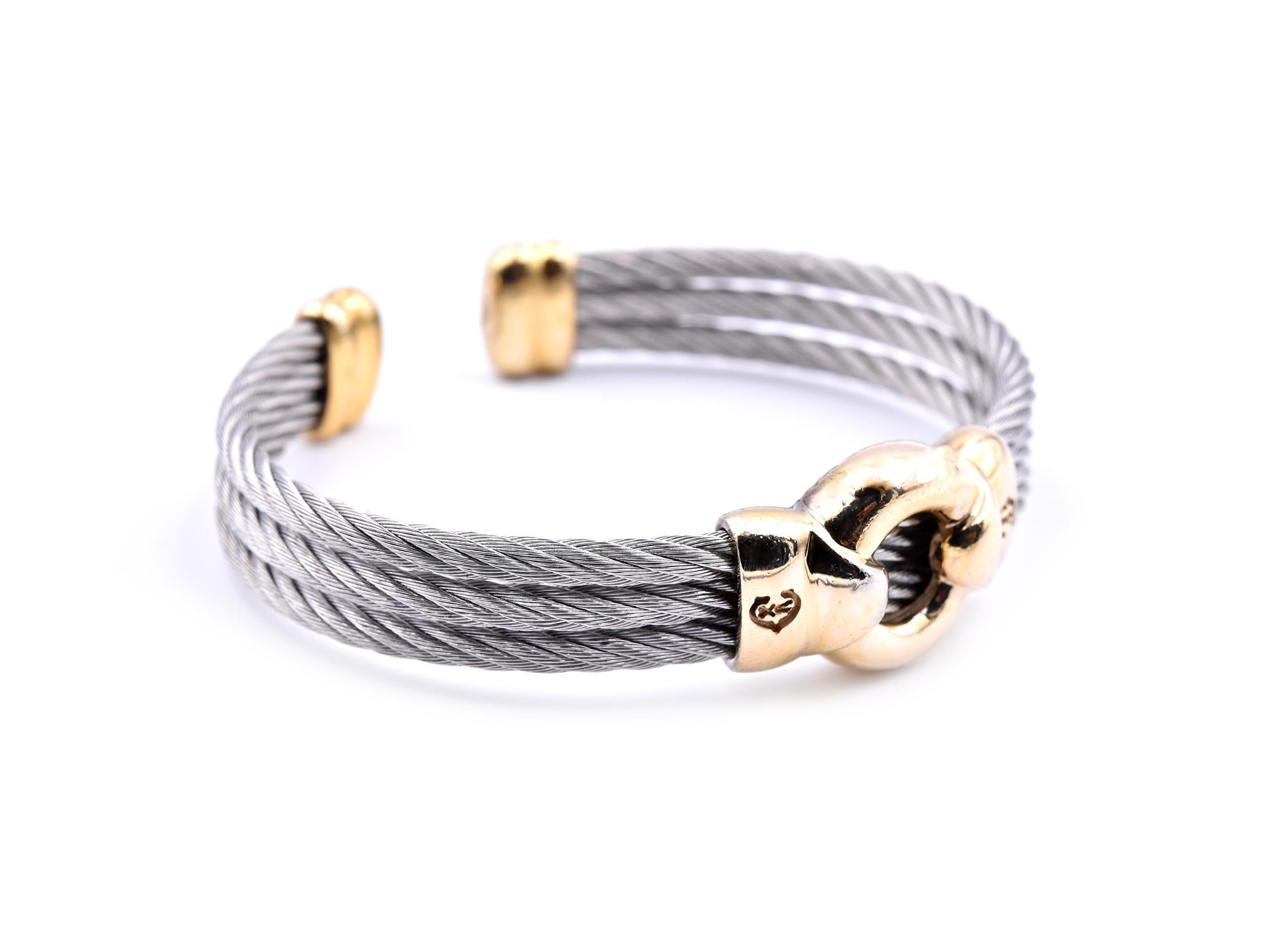 Designer: custom design
Material: 14k yellow gold and stainless steel
Dimensions: cuff bracelet will fit a 6 ½-inch wrist and it is 9.45mm-16.20mm wide
Weight: 31.8 grams
