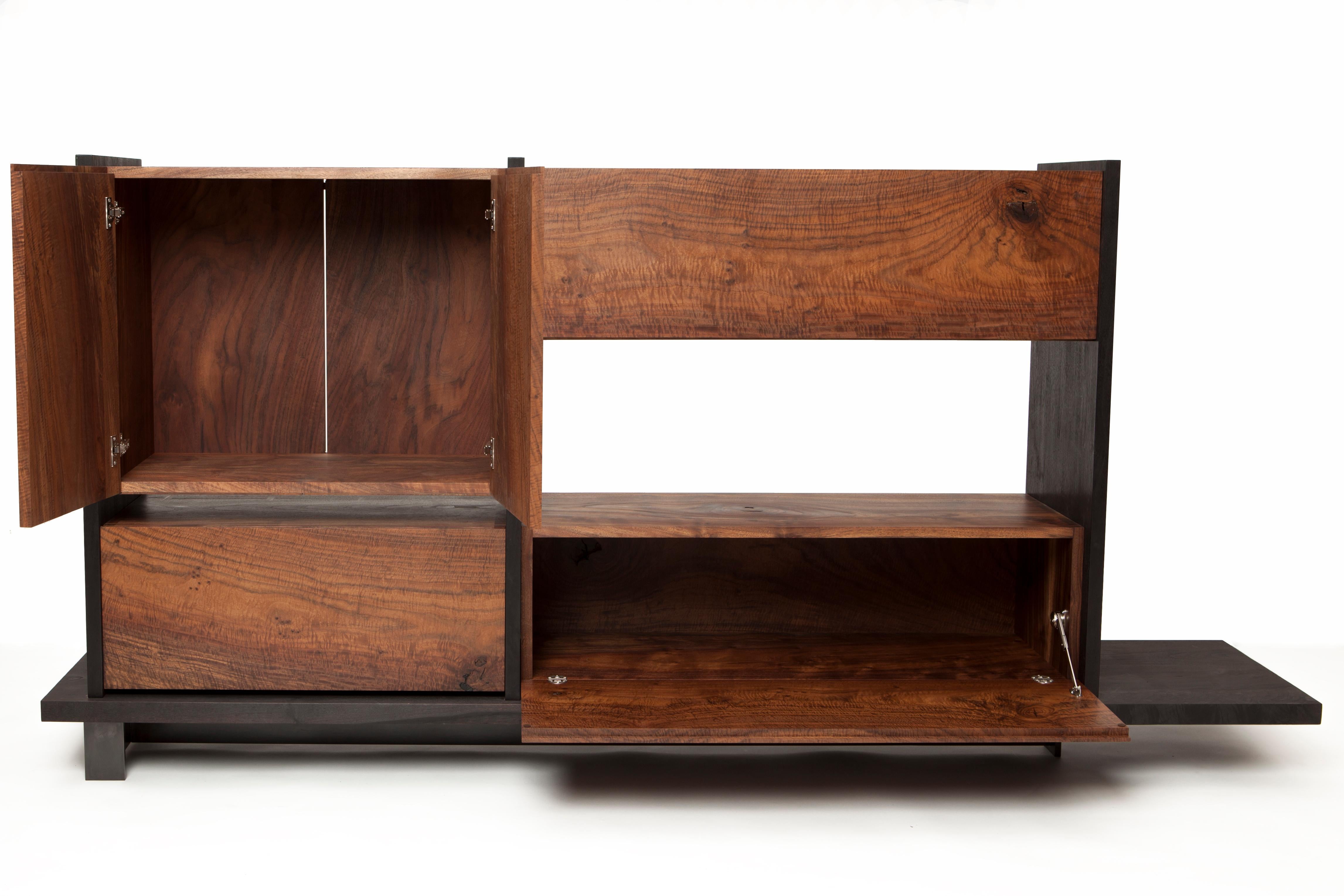 The Charro buffet cabinet by Taylor Donsker is crafted of solid, highly figured California Claro Walnut. The grain of the wood flows across each cabinet top and each cabinet face. The cases feature hand cut dovetail joinery for generations of