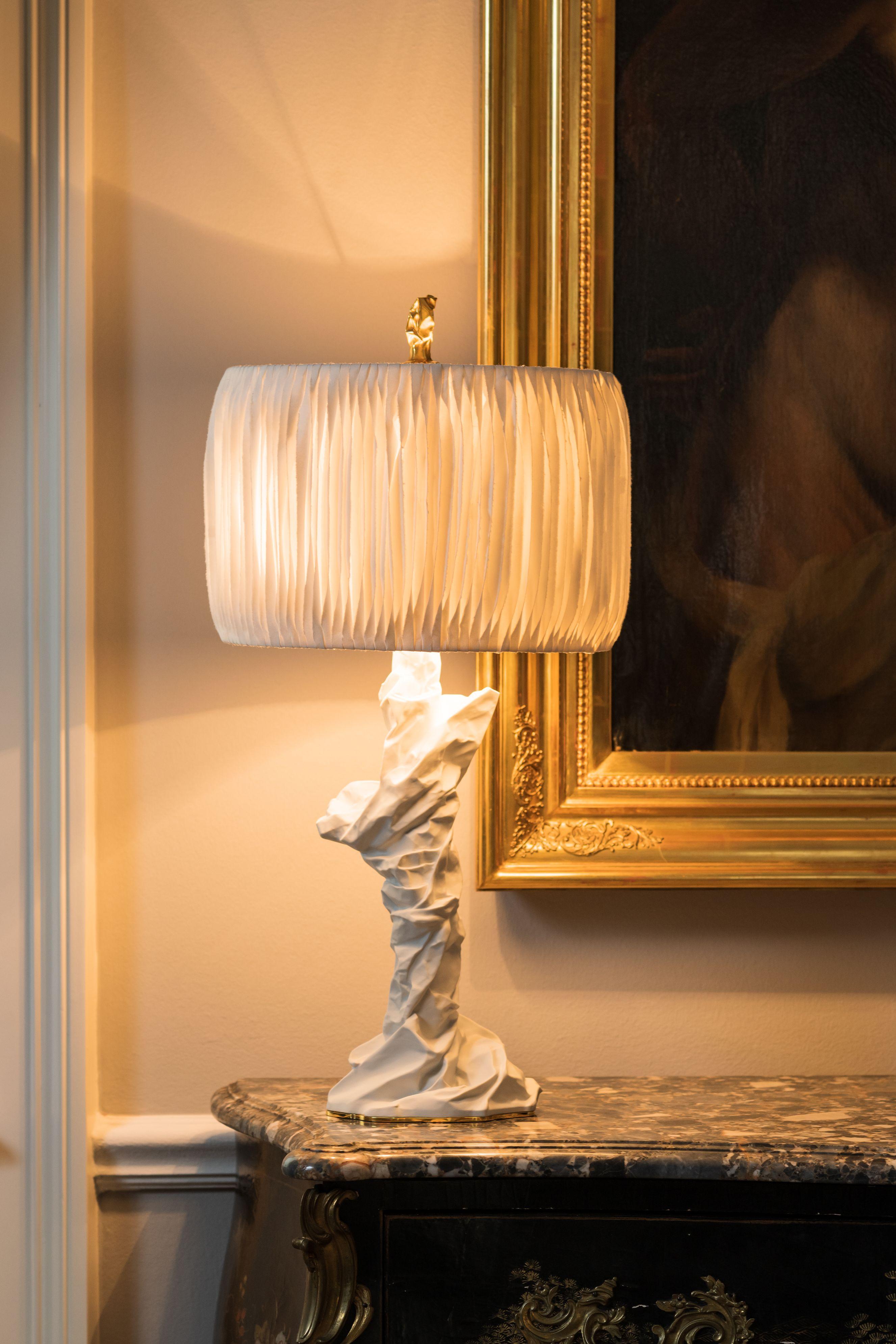 Charta Alba II table lamp by Studio Palatin.
Dimensions: H 75 x D 35 cm
Materials: biscuit porcelain, 24K gilded brass, Japanese hosho paper.

The artist’s inspiration for the Charta Alba Collection came from a series of sculptures formed from