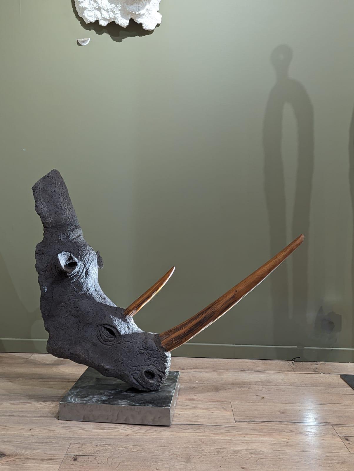 “On Edge” – A Contemporary Ceramic Sculpture of Strength and Sensitivity

“On Edge” is a ceramic sculpture, mounted on a metal base, capturing a suspended moment where the raw power of the rhinoceros reveals an unexpected delicacy. A symbol of