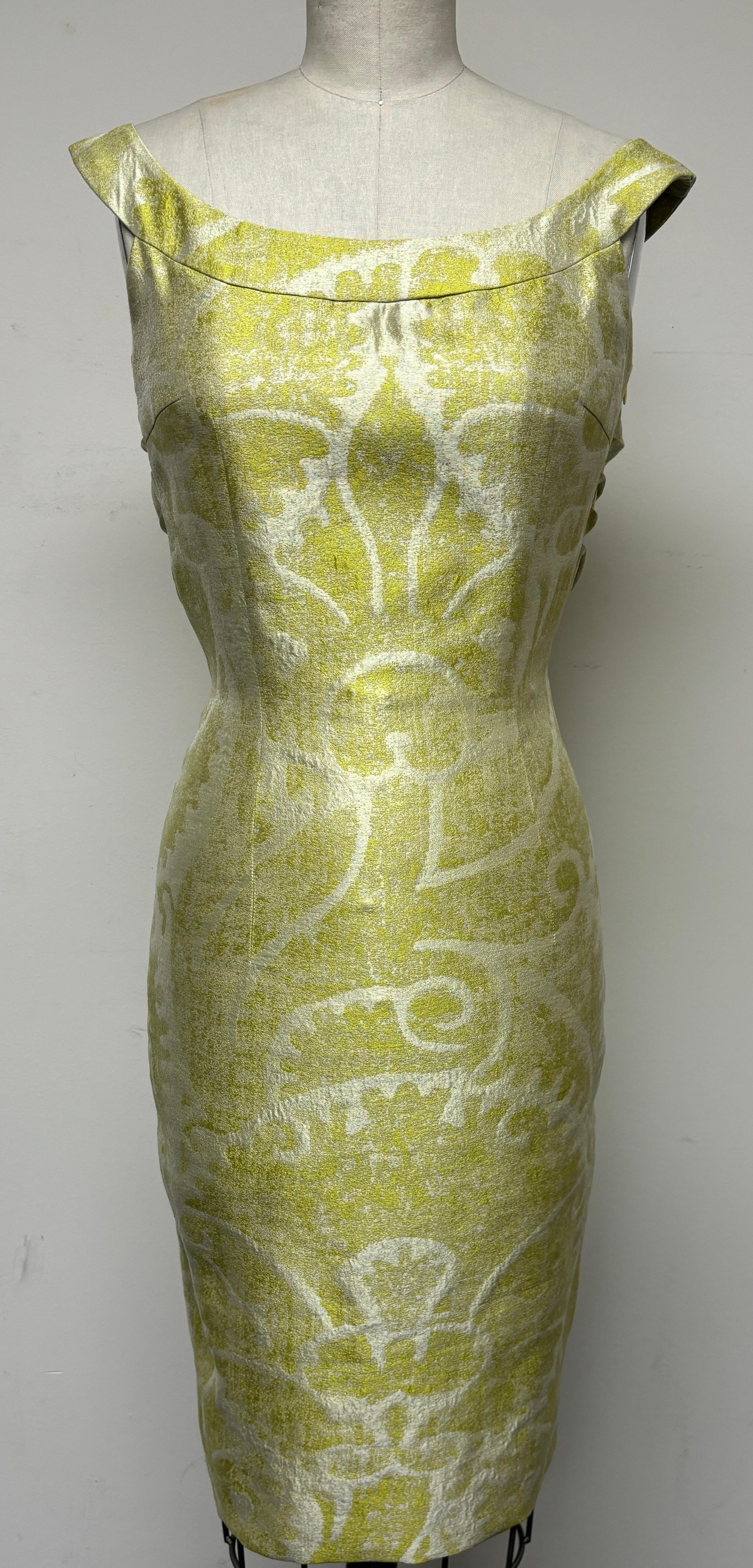 Made with an astonishingly beautiful abstract Fleur de Lis pattern from Switzerland, this chartreuse and pearl blouson back slim dress is a very unique jacquard. The front of the dress features a band that runs across the bodice while the back so