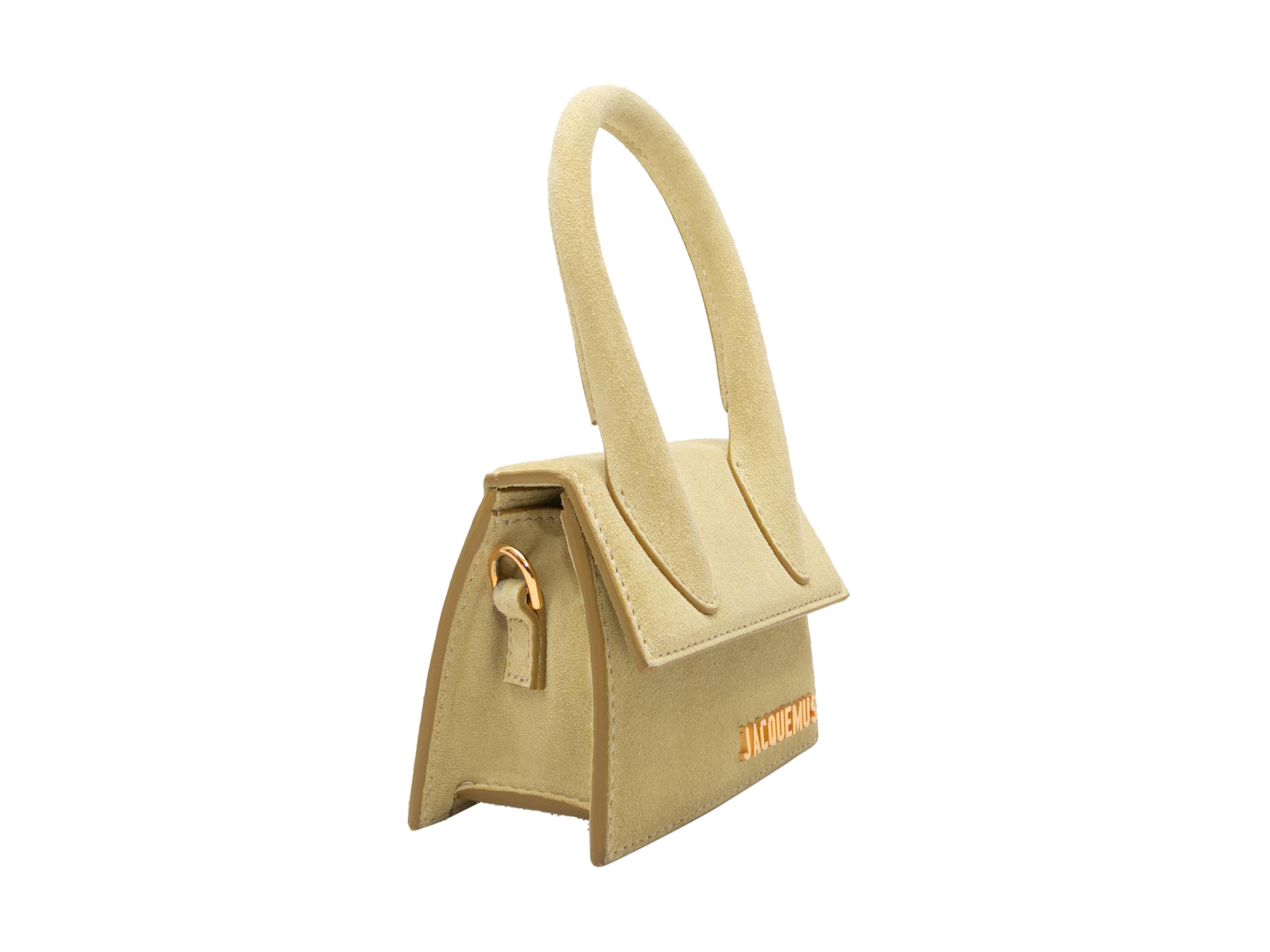 Chartreuse Jacquemus Suede Mini Crossbody Bag. This bag features a suede body, gold-tone hardware, a single rolled top handle, a single flat shoulder strap, and a front flap closure. 4.75
