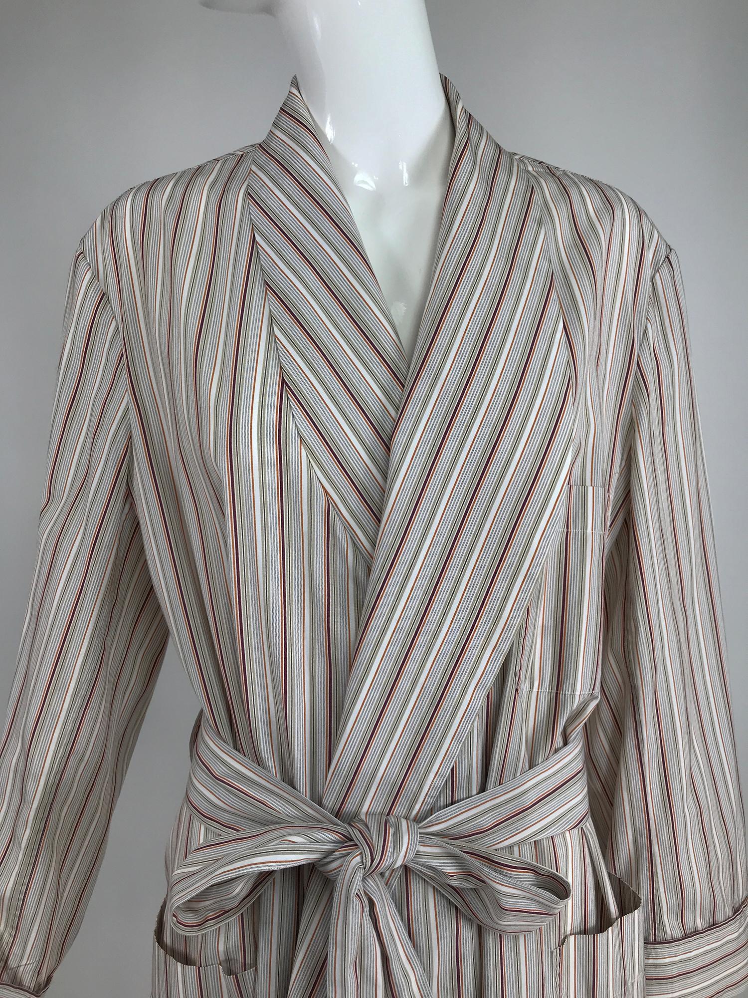Charvet Paris, striped cotton robe in brick,coral, cream and taupe. This beautiful robe looks barely, if ever worn. Shawl collar, self belted wrap with chest and hip patch pockets. Unlined. Charvet, makers of some of the most exclusive men's wear in