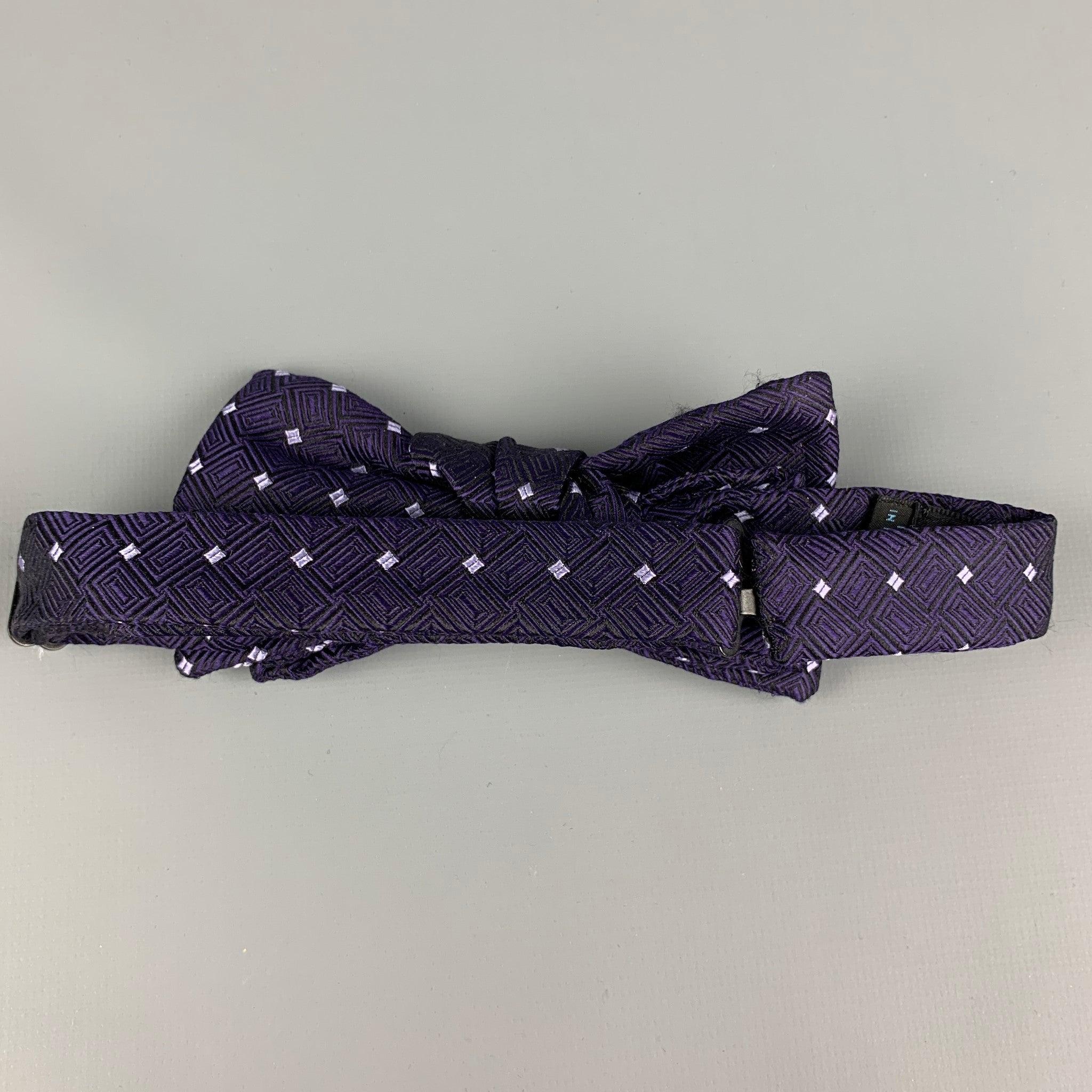 CHARVET bow tie comes in a purple & white square print silk with a hook & loop closure. Made in France.Very Good
Pre-Owned Condition. 

Measurements: 
  Width: 2.5 inches 
  
  
 
Reference: 113540
Category: Bow Tie
More Details
    
Brand: 
