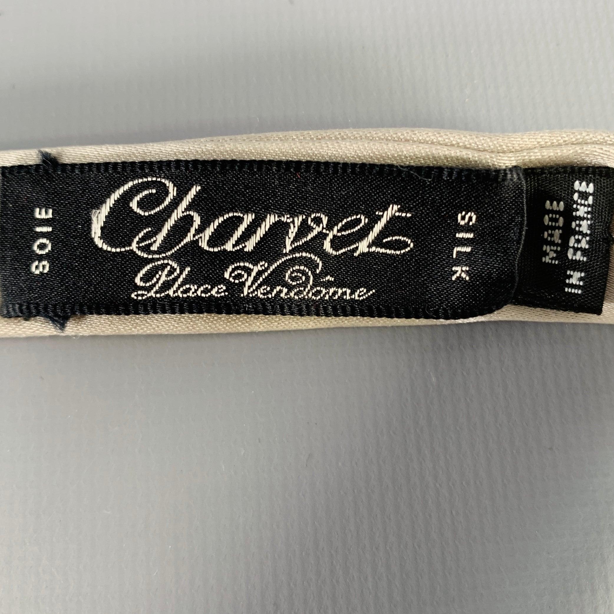 CHARVET bowtie in a silver silk fabric featuring a solid pattern. Made in France.Very Good Pre-Owned Condition. Minor signs of wear. 

Measurements: 
  Width: 2.75 inches  


  
  
 
Sui Generis Reference: 130151
Category: Bow Tie
More Details
   