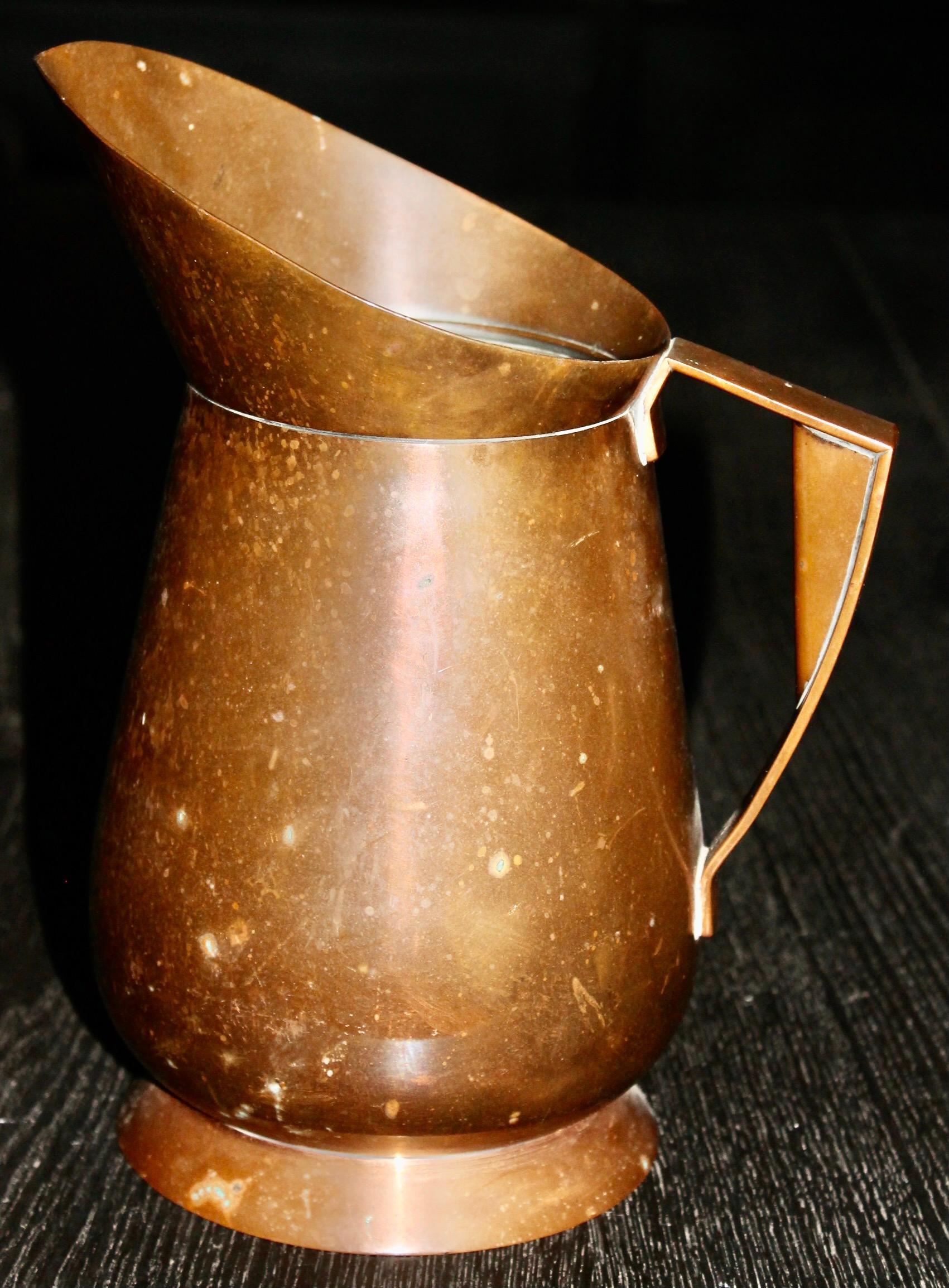 Rare American 'Machine Age' All Copper Pitcher, designed by Ruth Gerth
for Chase Brass and Copper, Meriden Connecticut. This version is without the decorative spherical indents (dimples). 