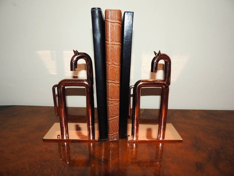 Extremely rare set of chase Equestrian bookends sculpture designed by Walter Von Nessen in 1932. Industrial Design incorporated with the latest materials and machine age approach. These are in mint condition with newly polished copper finish. Von