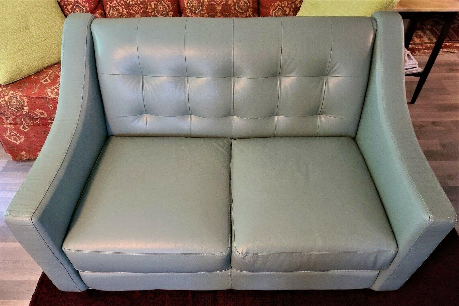 For FULL item description be sure to click on CONTINUE READING at the bottom of this listing.

Offering One Of Our Recent Palm Beach Estate Fine Furniture Acquisitions Of A
Chateau d'ax Tufted Real Leather Loveseat Settee Sofa

Color is a Teal