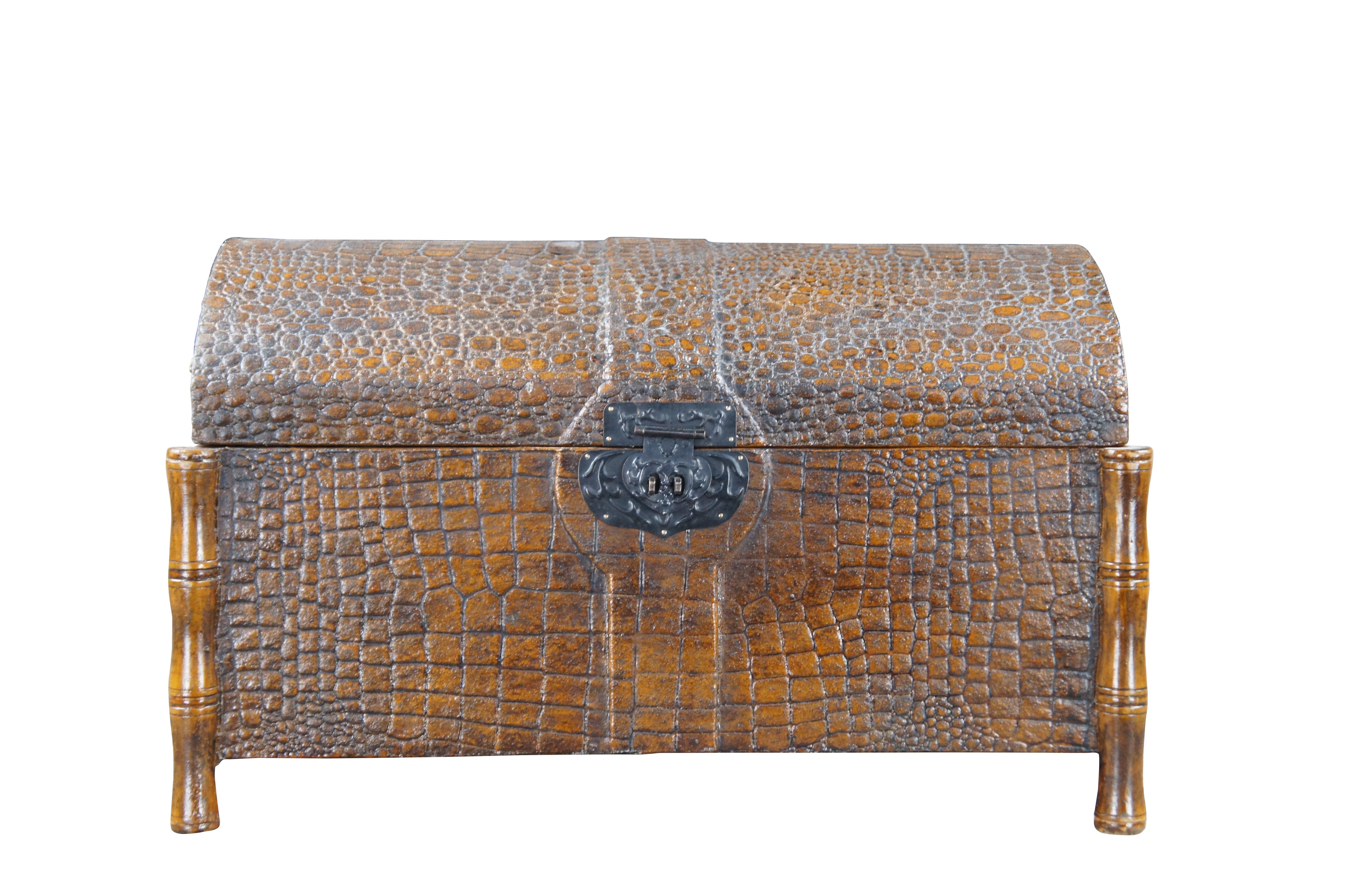 Chateau Edgewater Inc keepsake box. Features a domed exterior with faux alligator / bamboo form. Includes brass hardware with a silk line interior.

DIMENSIONS

19