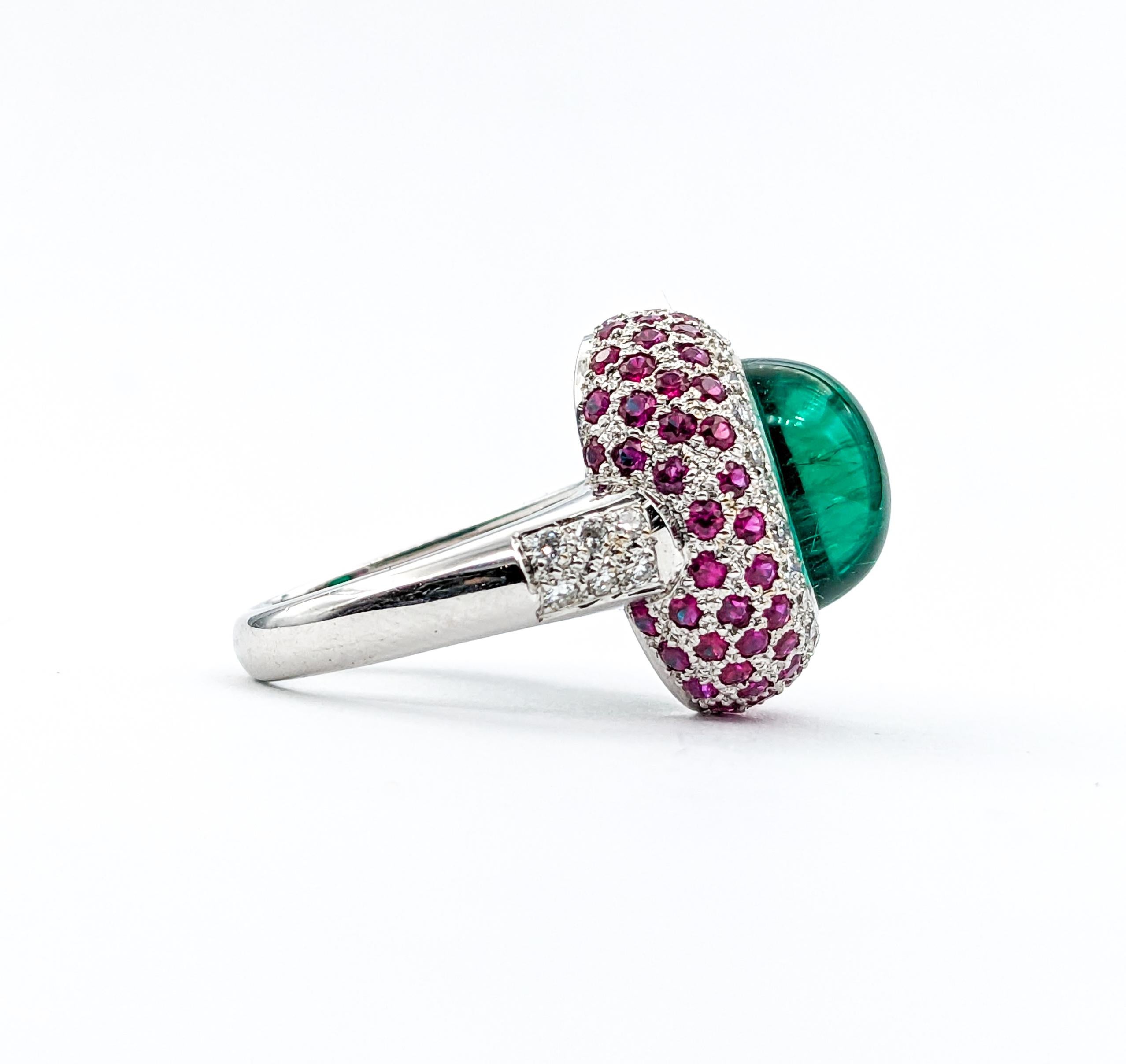 Chatham Emerald & Ruby , Diamond Ring In White Gold

Introducing this stunningly unique Emerald cocktail ring, beautifully crafted in 18K white gold. This ring boasts a sumptuous Green Chatham Emerald Cabochon surrounded by Diamonds and Rubies. The