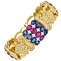 Chatila 32.85 Carat Ruby Sapphire Diamond 18 Karat Gold Fluer-de-Lis Bracelet