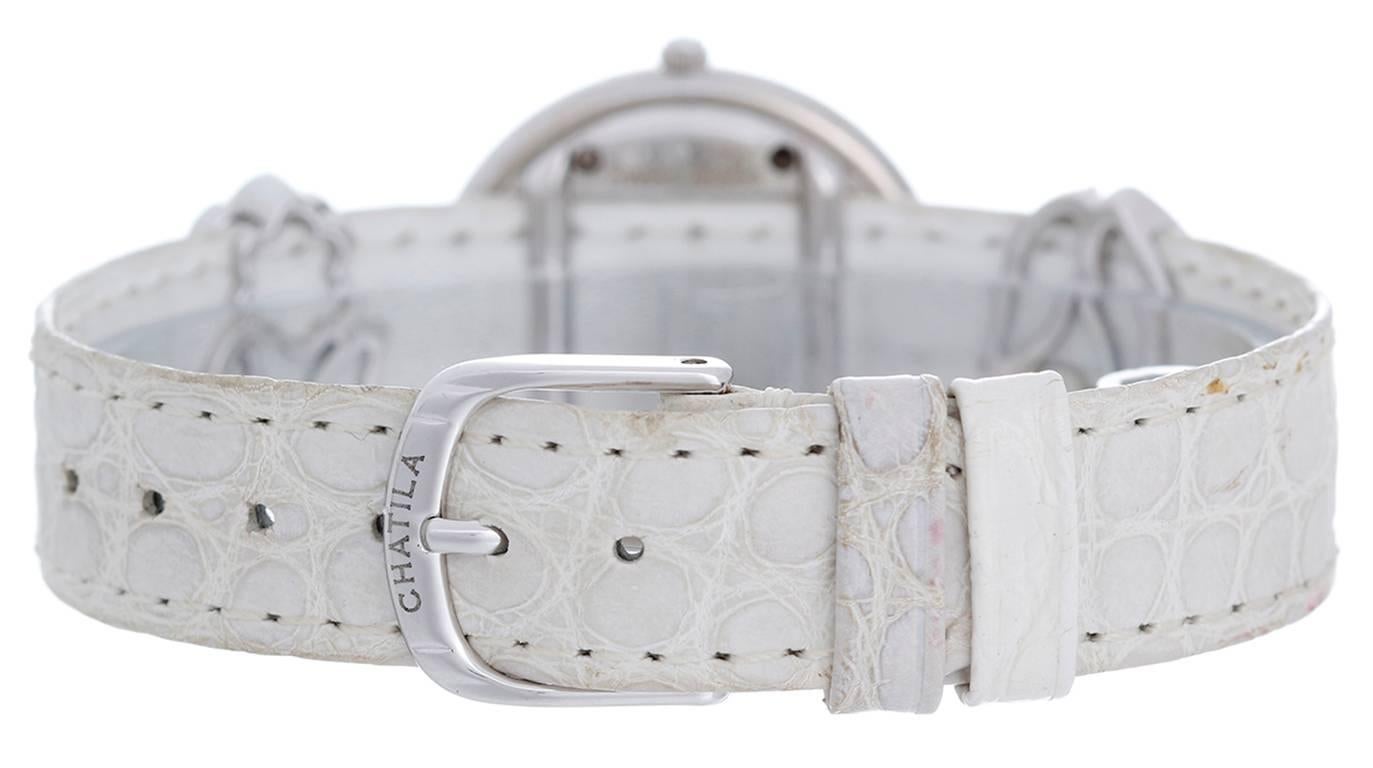 18k white gold full pave diamond case (29mm). Full pave diamond dial with faceted crystal. Chatila white alligator strap band with diamond flower accents that slide on the strap and can be removed; 18k white gold Chatila buckle. There are different