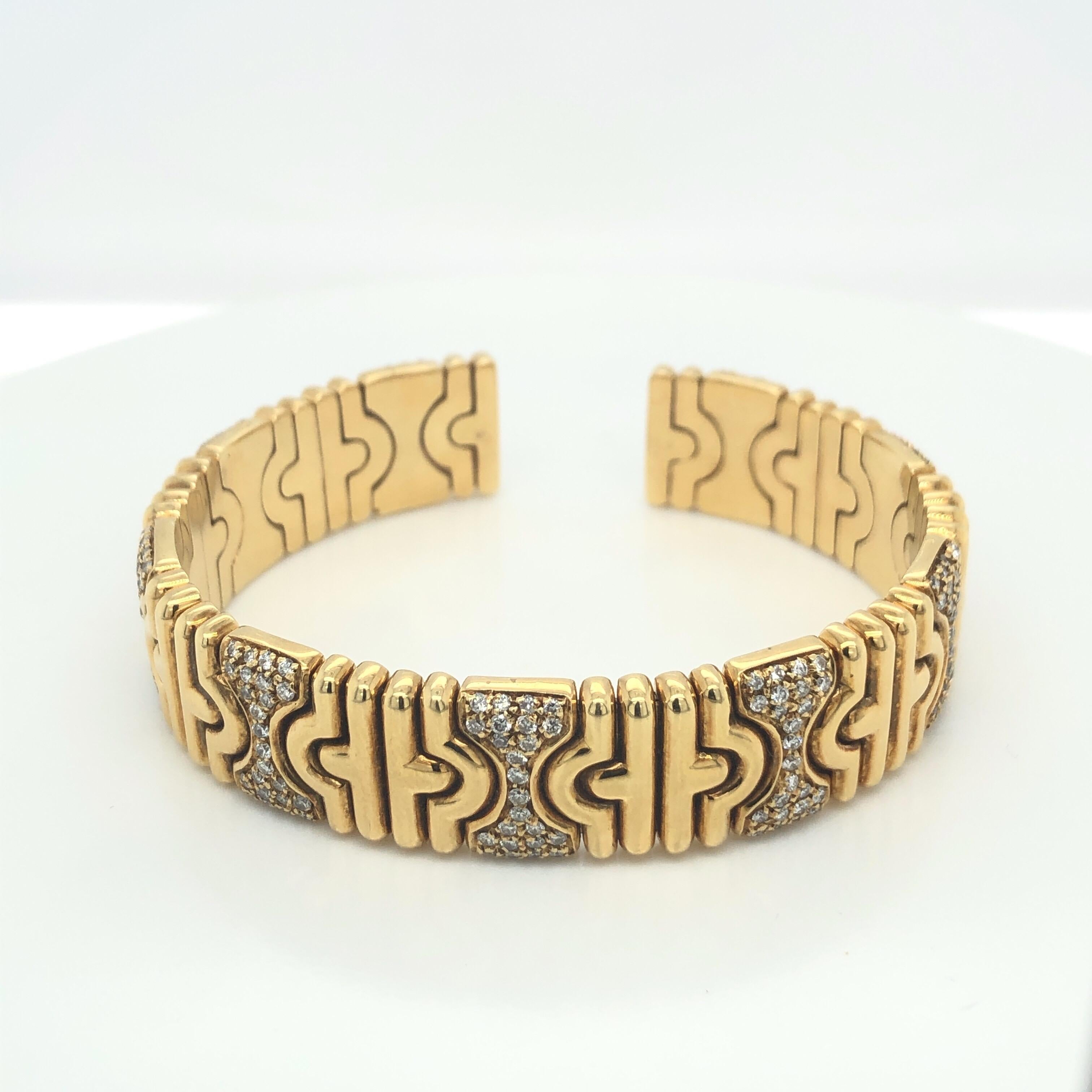 18k Yellow Gold Flexible Cuff Bracelet from Chatila with Diamonds Set in Hourglass Formation. Stamped 750.