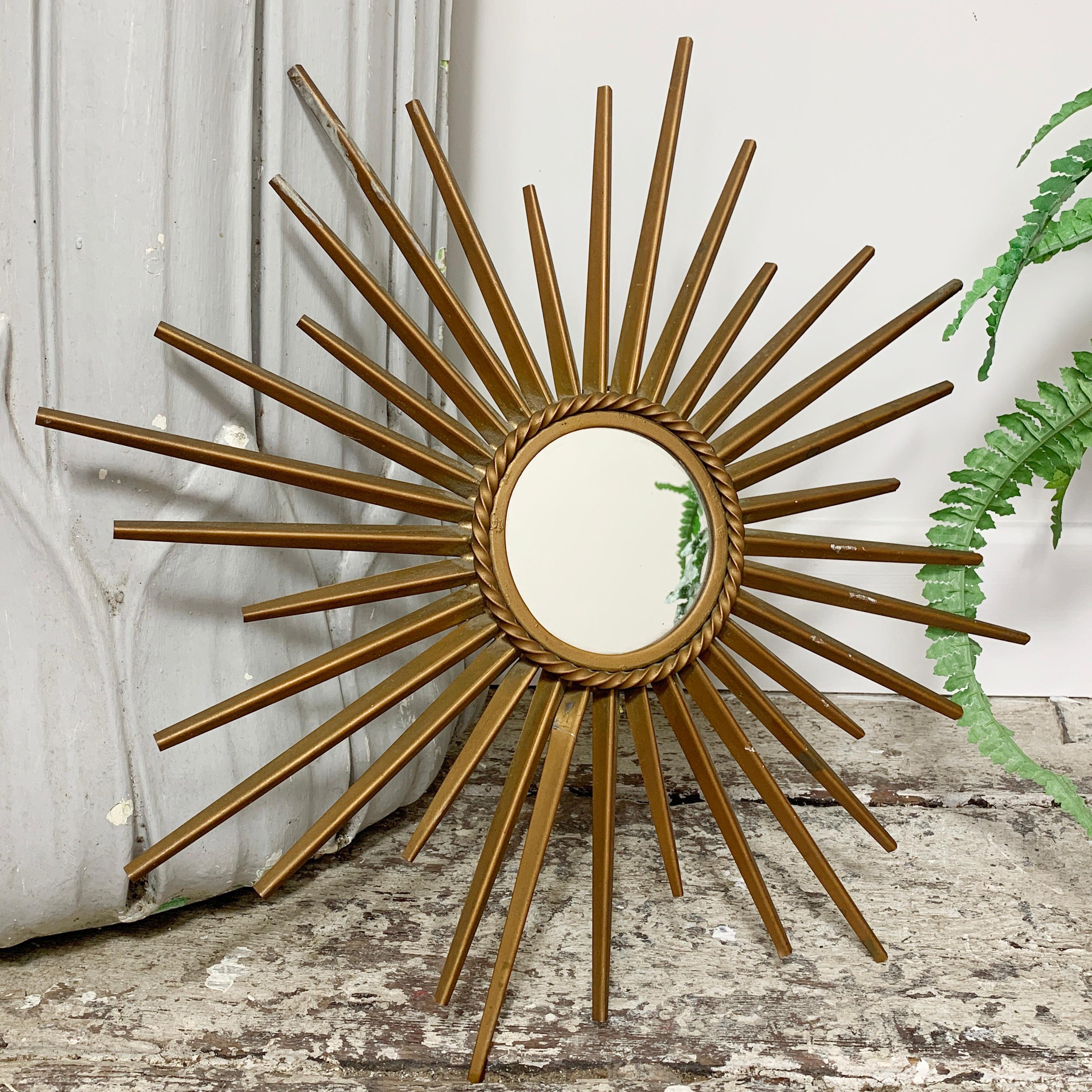 Petite Chaty Vallauris sunburst mirror,
France, 1950s
Stamped on the reverse 'Chaty Vallauris A.M’
Great condition for age
Rare smaller size
One of the rays has a kink to the metal
Measures: Width 40 cm, depth 2.5 cm, mirror 7.5 cm.

 